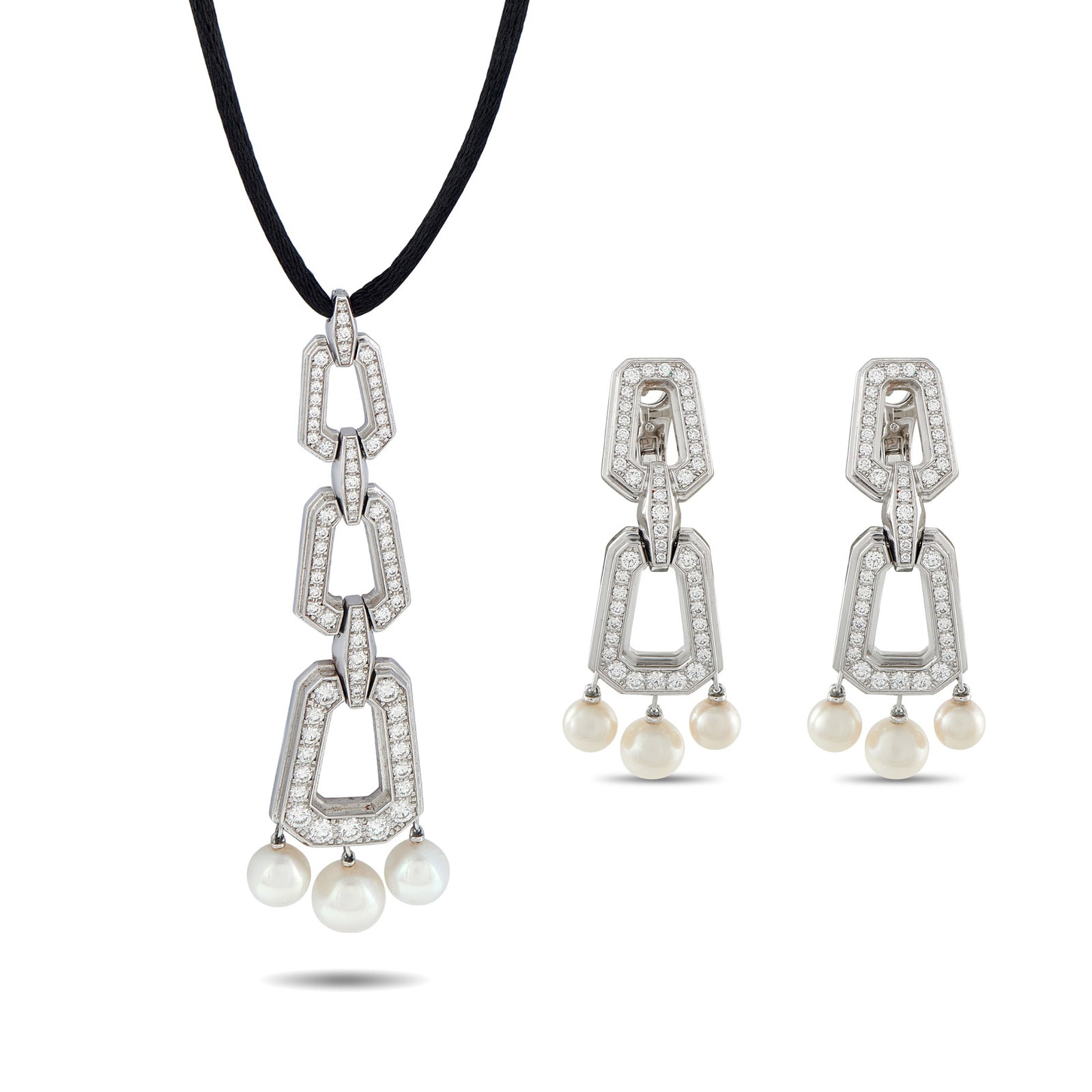 Cartier Chandra 18K White Gold Diamond and Pearl Necklace: This stylish Cartier Chandra set comes complete with a necklace and a matching pair of earrings. Crafted from 18K White Gold, sparkling Diamonds and luminous Pearls make this an elegant addition to an