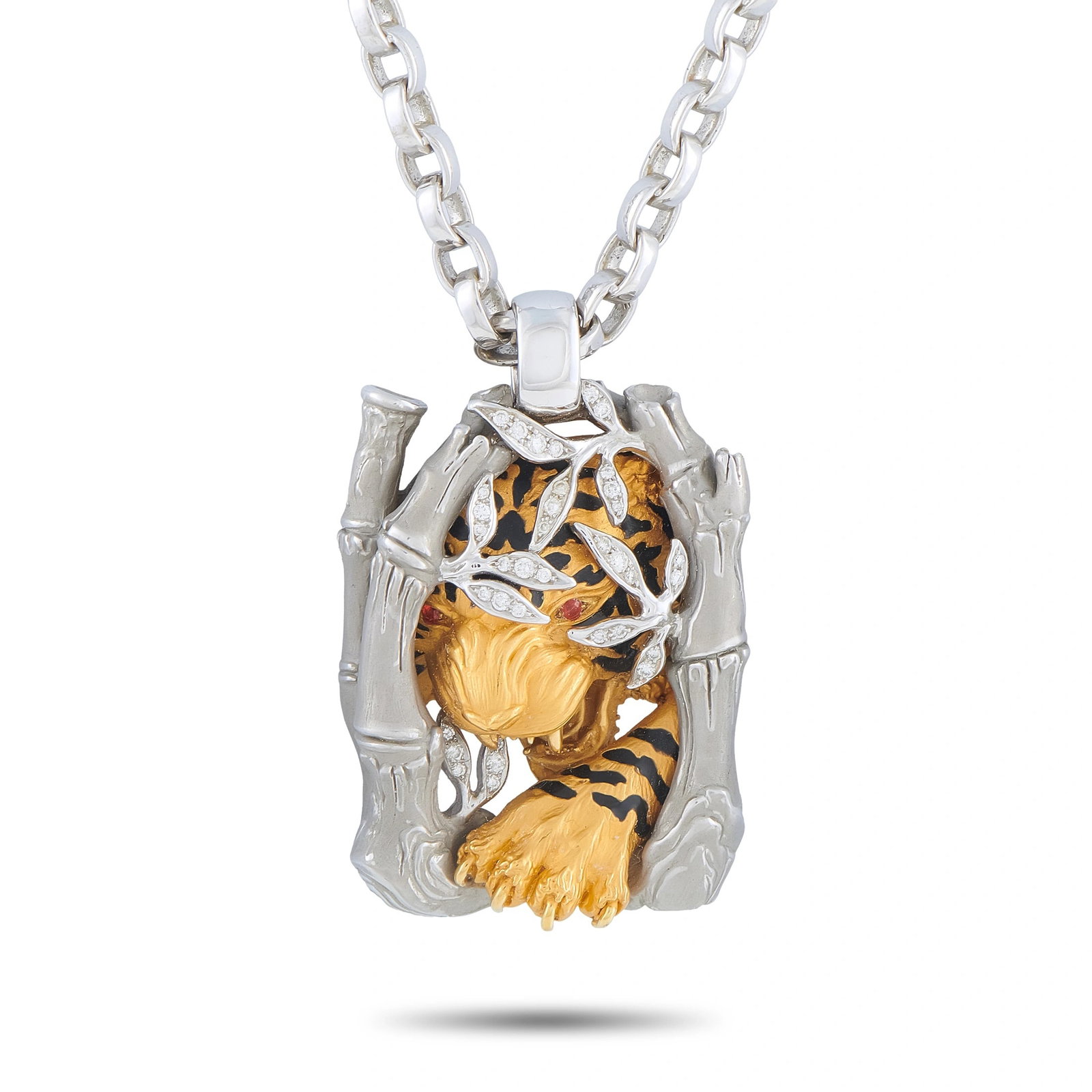 Magerit 18K Yellow and White Gold Diamond Tiger Pendant: A striking tiger motif emerges from a bamboo forest on this incredibly detailed Magerit necklace. Diamond accents add subtle sparkle to this eye-catching accessory. Crafted from a combination of 18K W