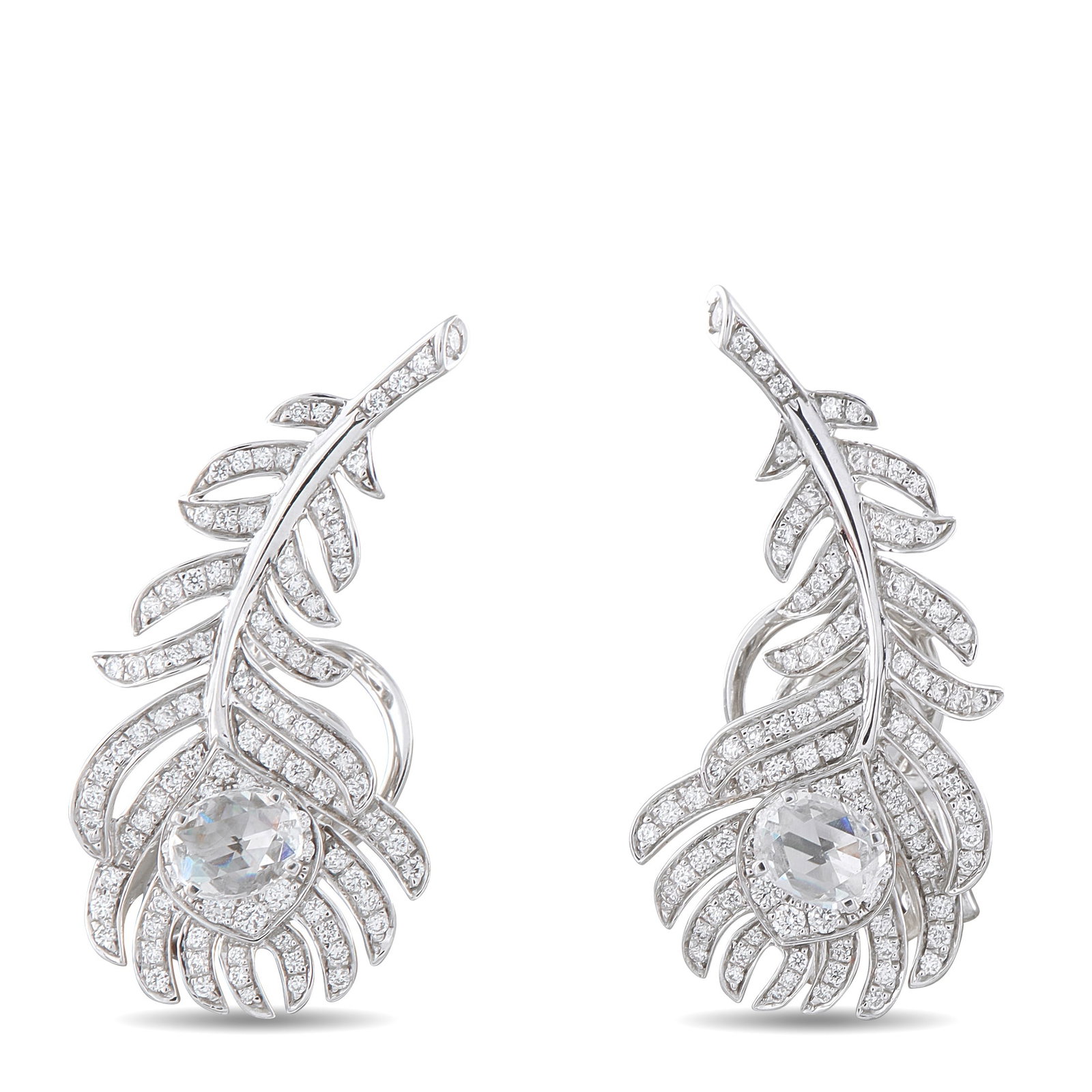 Boucheron Plume de Paon 18K White Gold 1.10ct Diamond Earrings: These dazzling Boucheron Plume de Paon earrings draw inspiration from the beauty of the natural world. Designed to resemble delicate peacock feathers, sparkling Diamonds totaling 1.10 carats make them