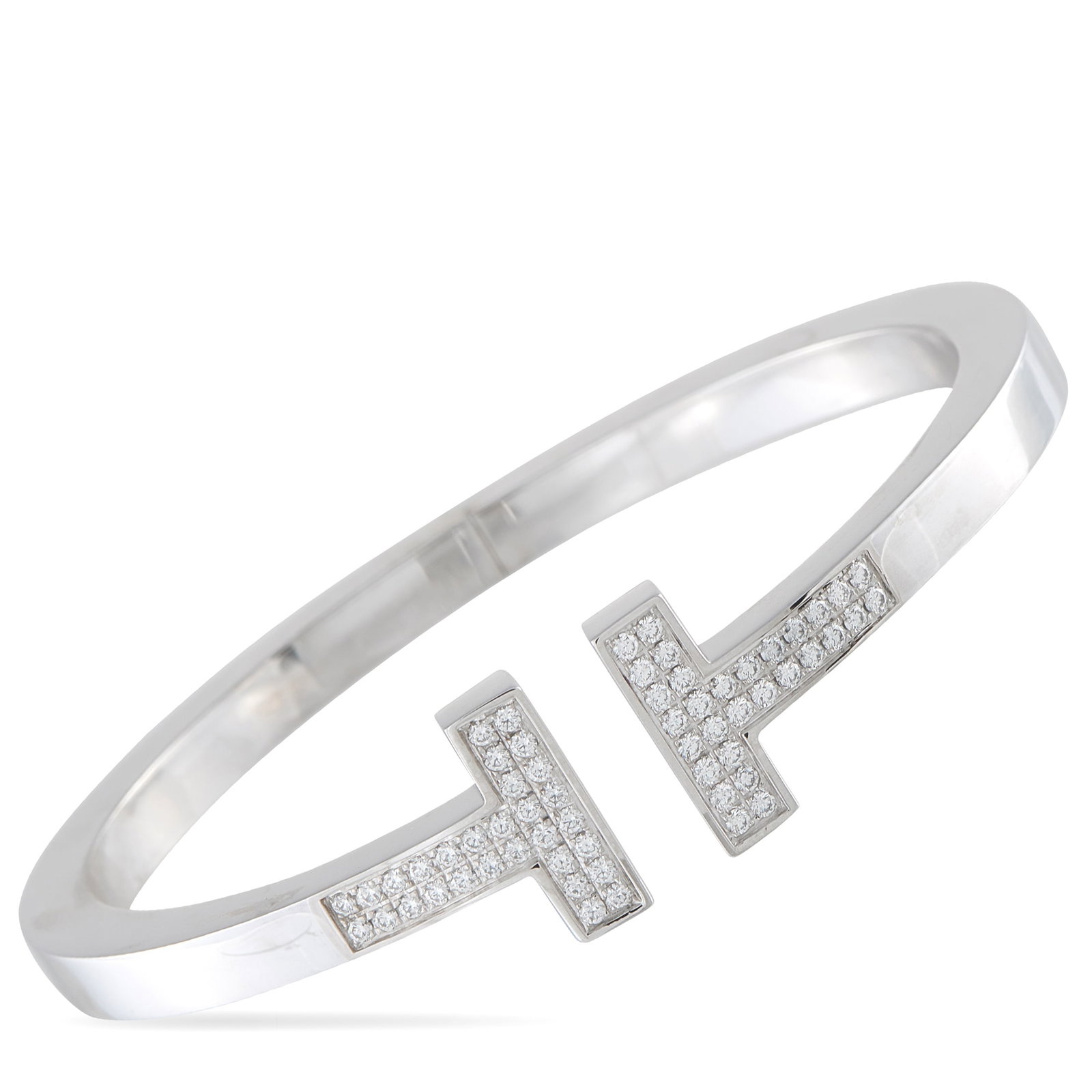 Tiffany & CO. T 18K White Gold 0.74ct Diamond Bracelet: This Tiffany & Co. Tiffany T bracelet offers clean lines and a classic sense of sophistication. Diamonds totaling 0.74 carats highlight this piece’s iconic “T” shaped motif – a design that