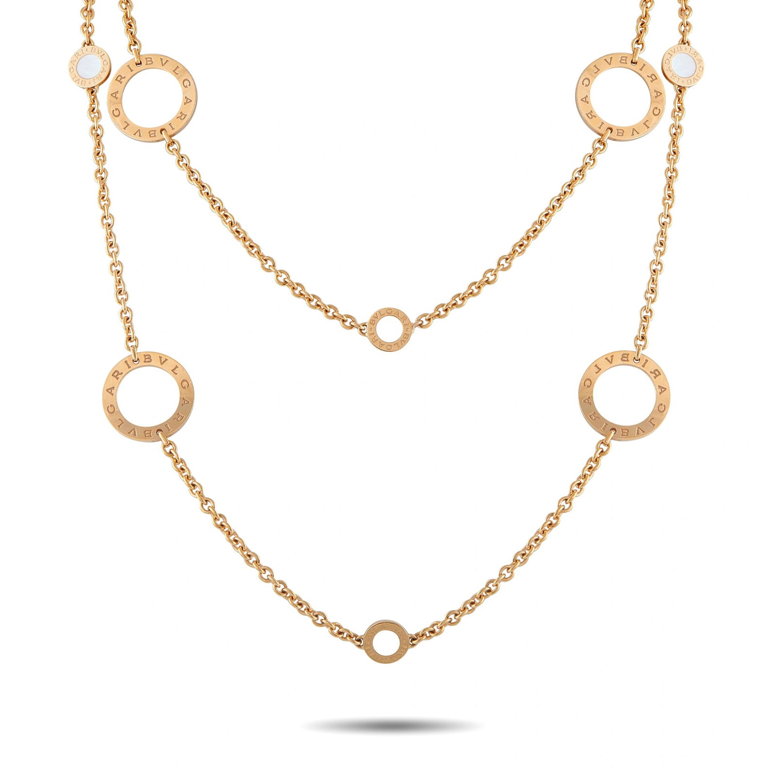 Bvlgari 18K Yellow Gold Open Circle Station Necklace: This dramatic Bvlgari necklace will continually impress. Crafted from 18K Yellow Gold, a series of circular pendants boldly display the luxury brand’s moniker. It measures 38” long and weighs 