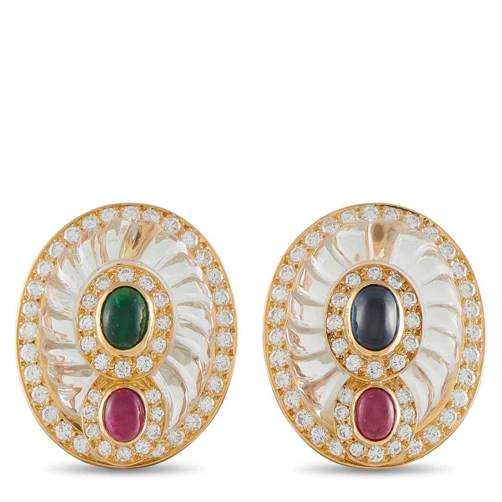 Boucheron 18K Yellow Gold Diamond, Crystal, Ruby and Emerald Oval Clip: A magnificent pair of estate Boucheron earrings masterfully crafted in 18-karat yellow gold. Each large oval earring presents an intricately fluted rock crystal body — a hallmark of Boucheron’s ex