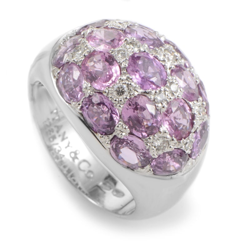 Tiffany & CO. 18K White Gold Pink Tourmaline & Diamond Dome Ring: Luxurious and feminine, this ring from Tiffany & Co. is sure to be treasured for many years to come. The ring is made of 18K white gold and features a glittering white diamond and pink tourmaline pave