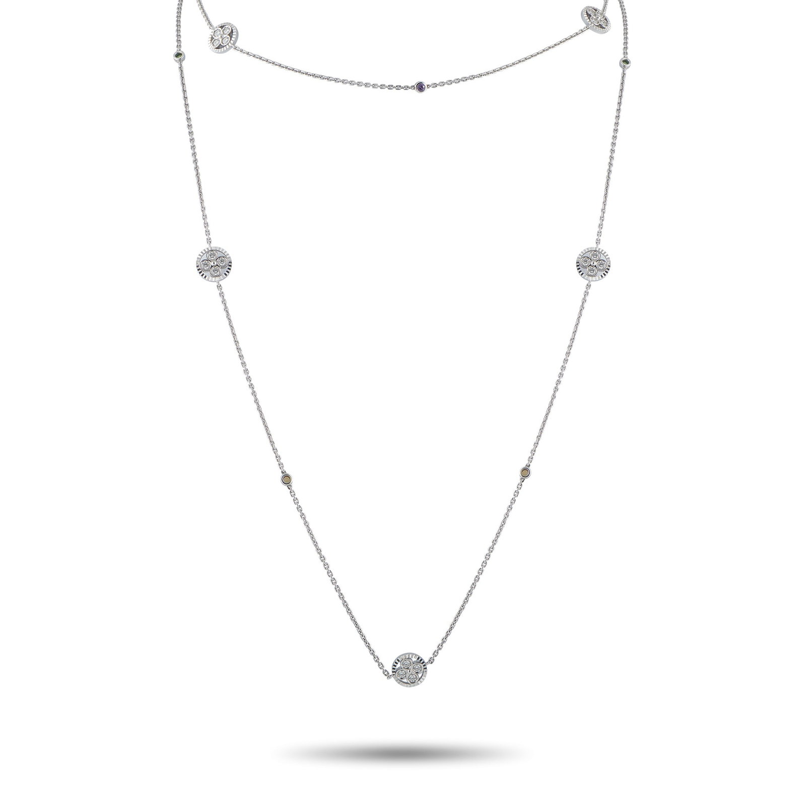 Louis Vuitton 18K White Gold 1.40ct Diamond and Ruby Necklace: This Louis Vuitton necklace is both delicate and dramatic. The simple 18K White Gold chain is elevated by subtle Ruby accents, stylish circular motifs, and Diamonds totaling 1.40 carats. It measures 3