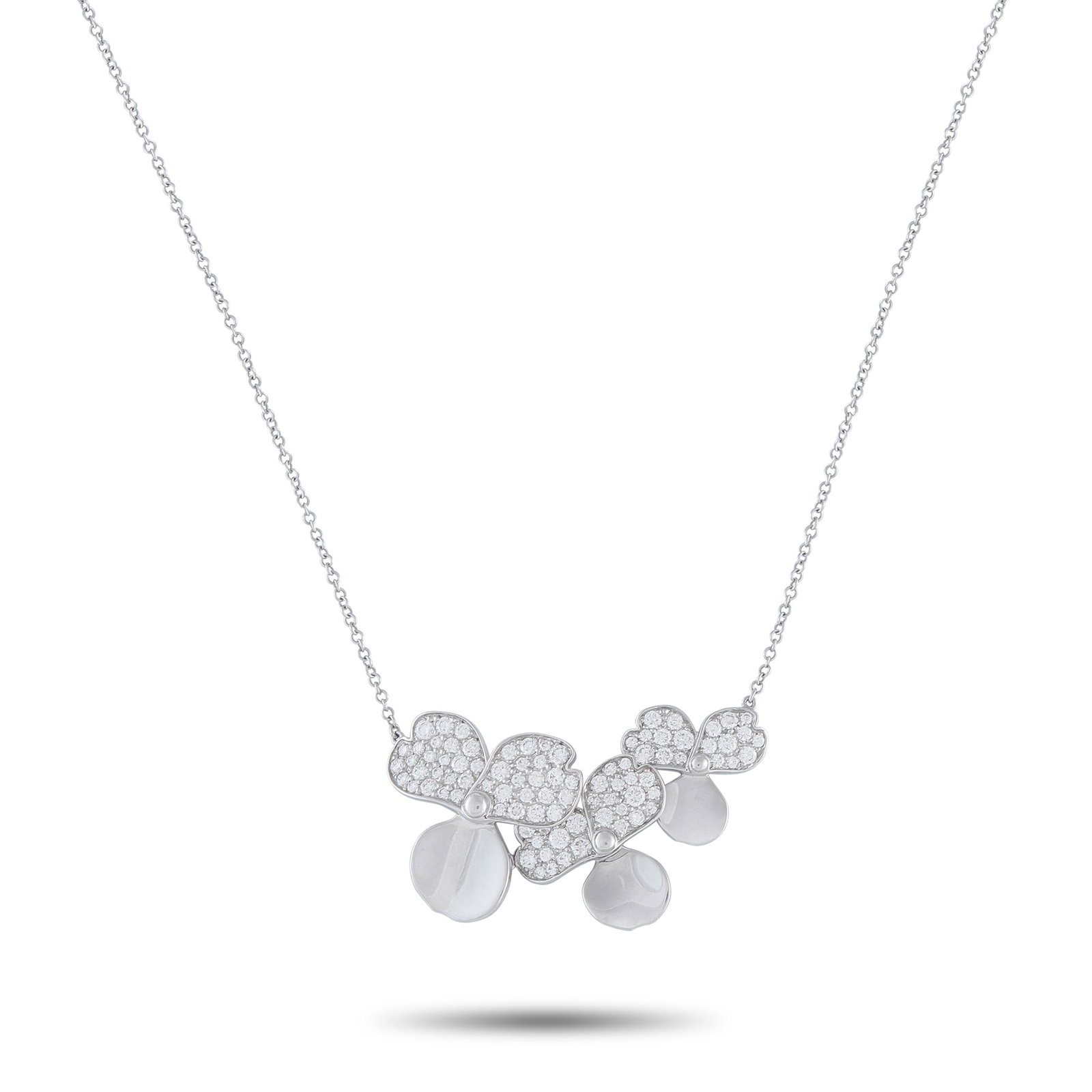 Tiffany & CO. Paper Flowers Platinum Diamond Pendant: This Tiffany & Co. Paper Flowers necklace balances a soft, feminine aesthetic with sleek sophistication. Set in Platinum, the three-petal floral motifs are elevated by dazzling inset Diamonds. The pen
