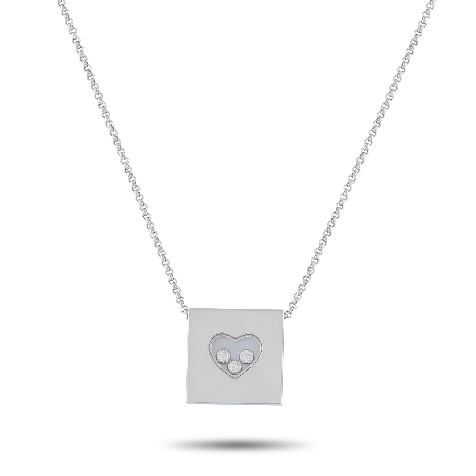Chopard Happy Diamonds 18K White Gold 0.17ct Diamond Necklace: This Chopard Happy Diamonds necklace offers enduring elegance. The pendant includes a transparent heart-shaped center that contains a trio of floating Diamonds totaling 0.17 carats. Crafted from 18K W