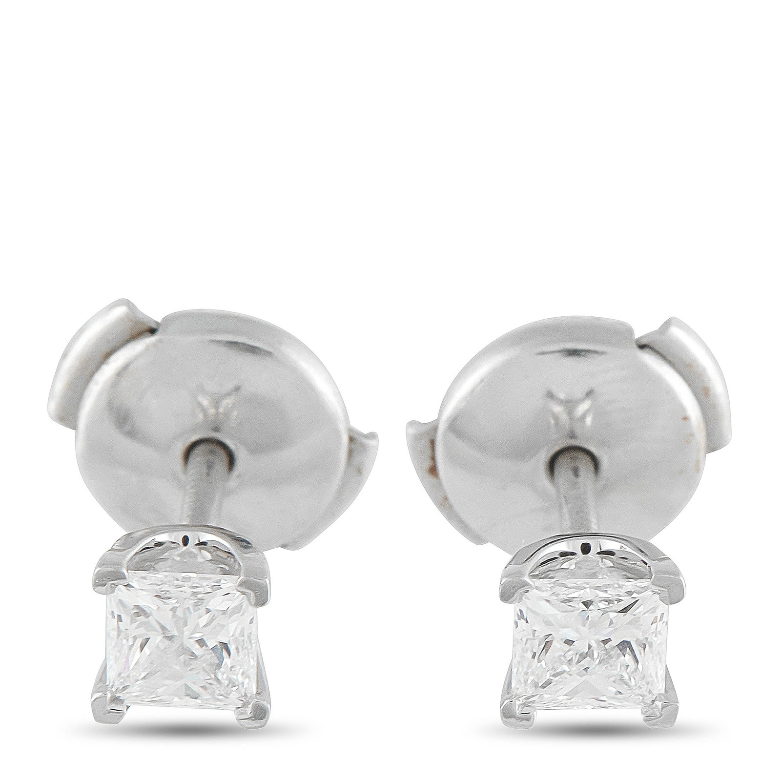 Tiffany & CO. Platinum 0.64ct Diamond Stud Earrings: These simple, elegant Tiffany & Co. stud earrings are ideal for any occasion. A staple piece of any jewelry collection, they come complete with square-cut Diamonds totaling 0.64 carats in a classic 4-
