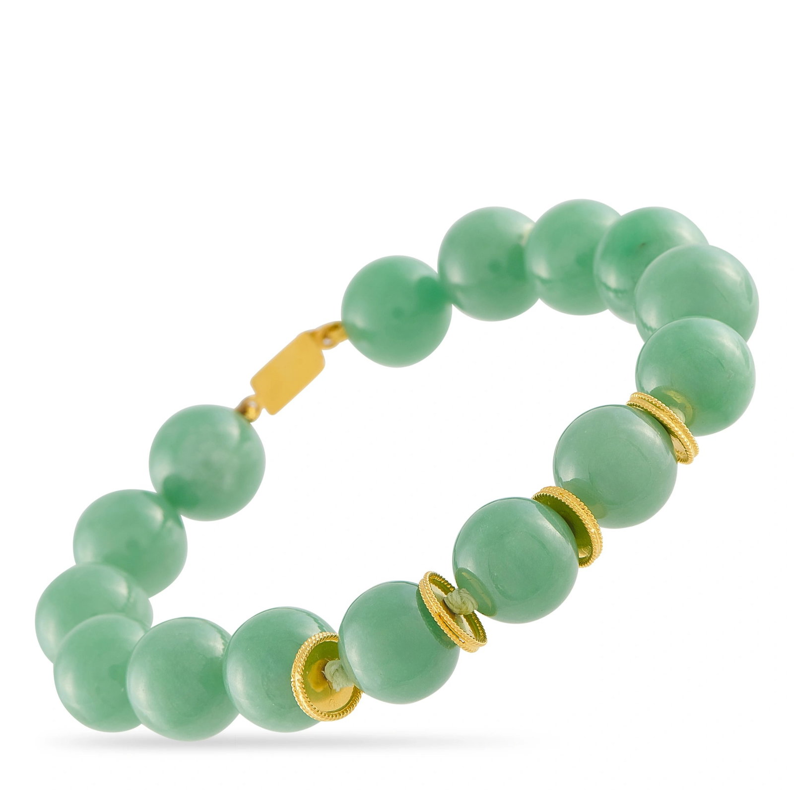 18K Yellow Gold Jade Bracelet: This bracelet is composed of polished round jade beads accented with 18K yellow gold rondelles. It measures 7 inches in length and secures with a box clasp. The bracelet includes a gift box. Metal & S