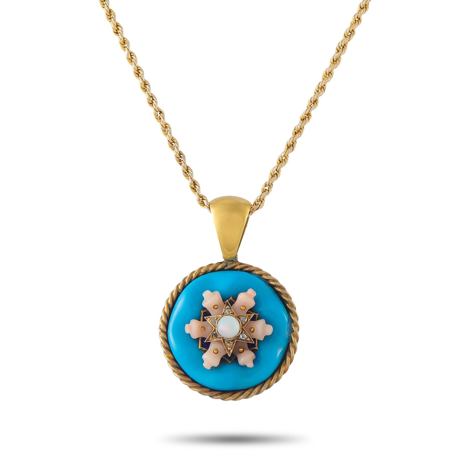 Antique 14K Yellow Gold Turquoise and Coral Necklace: This necklace is an antique design crafted in 14K yellow gold, featuring a round turquoise pendant centered with a coral and opal star motif accented by rose-cut diamonds, suspended from a rope-link c