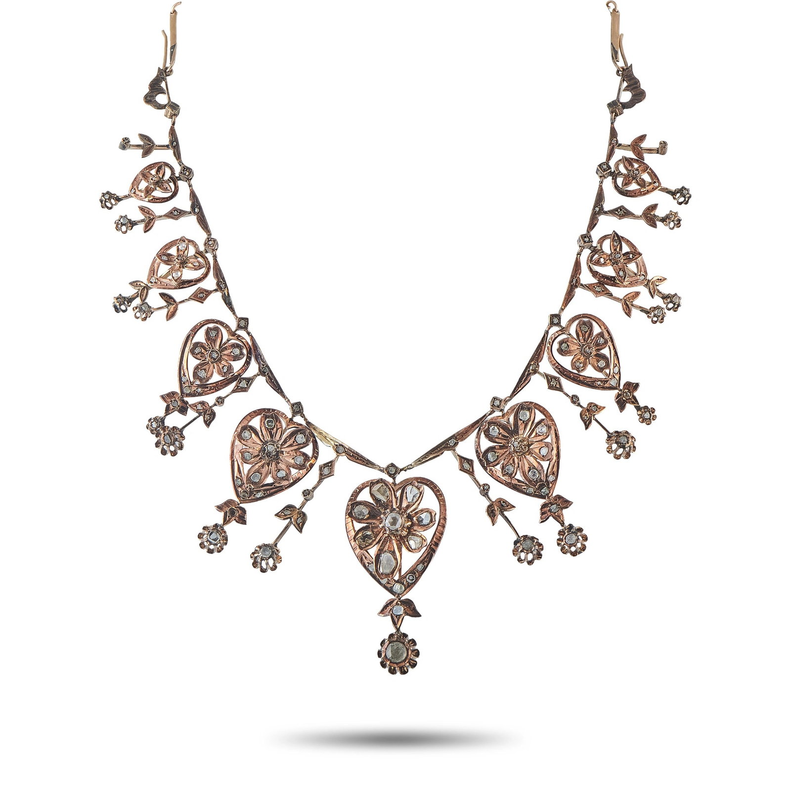 Antique 10K Rose Gold Diamond Necklace: This necklace is an antique Victorian-era design crafted in 10K rose gold, featuring a festoon of heart-shaped floral motifs set throughout with rose-cut diamonds and finished with dangling floral dro