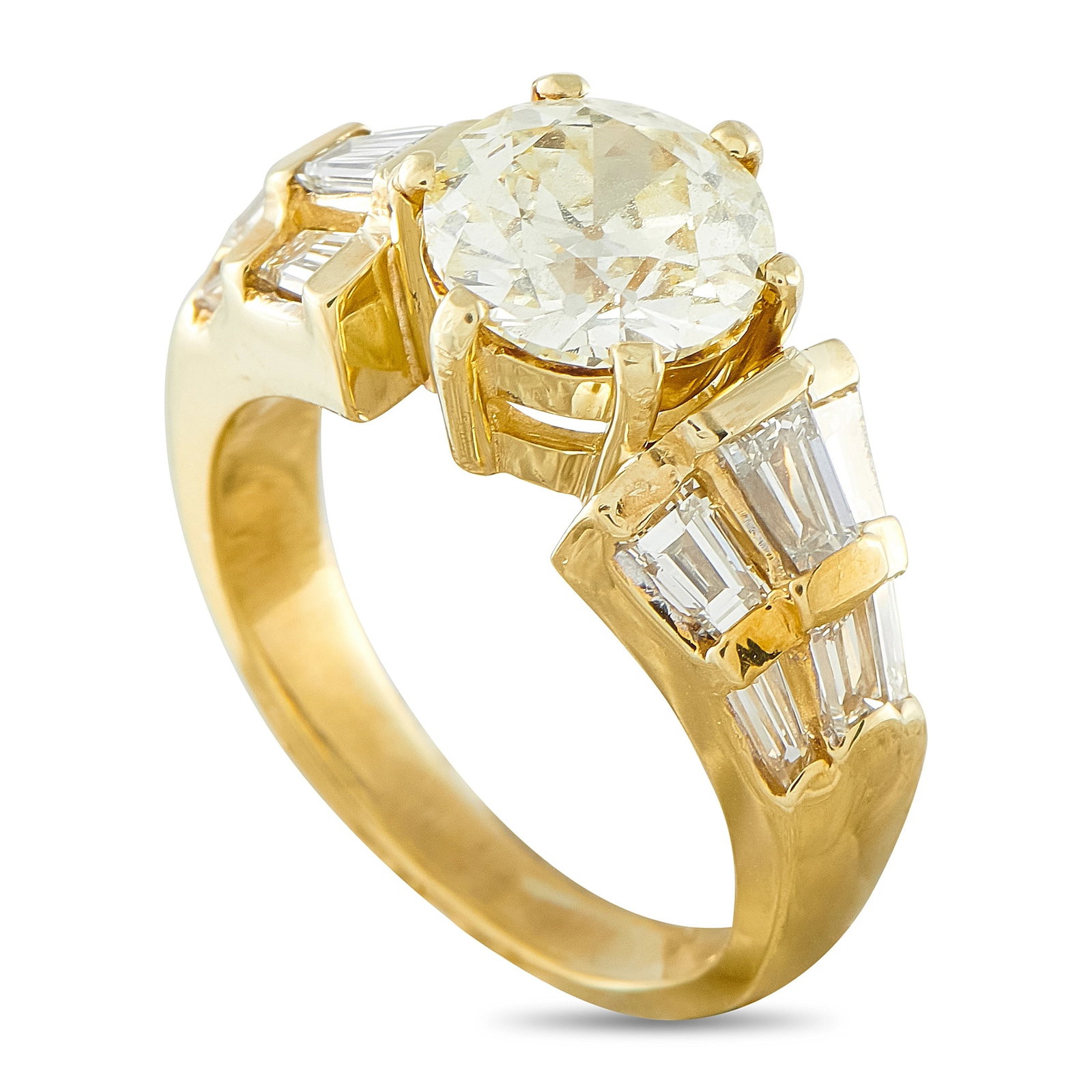18K Yellow Gold 3.16ct Diamond Ring: This 18K yellow gold ring features a round brilliant-cut diamond center stone of approximately 2.11 carats, bordered by tapered baguette diamond accents totaling approximately 1.05 carats, for a total