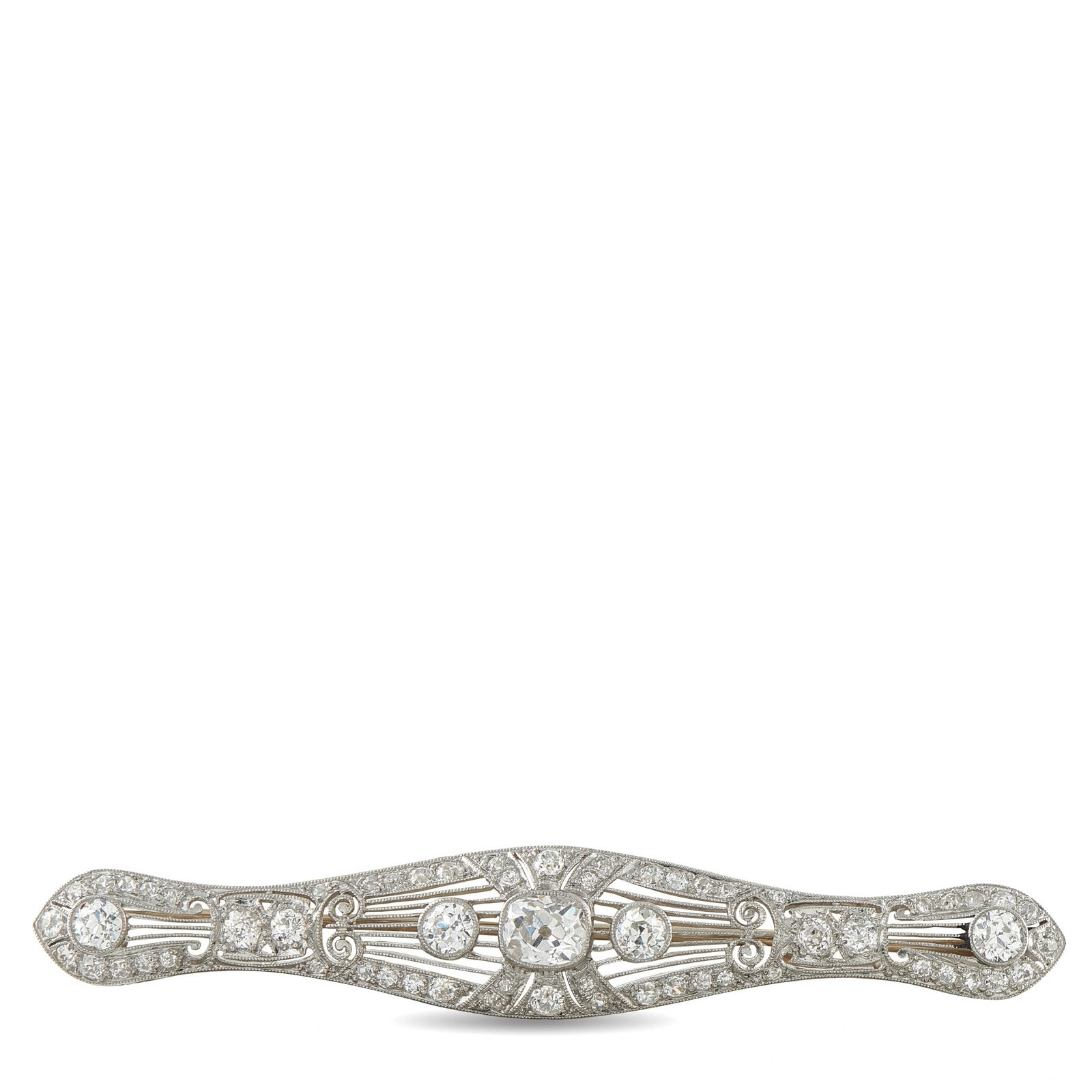 Platinum and 18K White Gold 2.60ct Diamond Art Deco Brooch: This Art Deco brooch is crafted in platinum and 18K white gold in an elongated, gently curved bar silhouette, pierced with fine filigree and set throughout totaling approximately 2.6 carats, anchored 