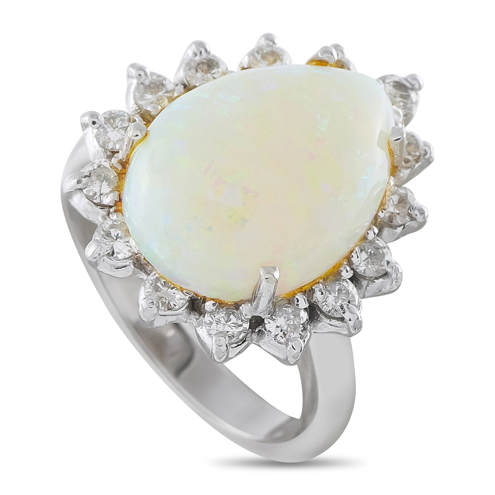 18K White Gold 0.65ct Diamond and Opal Halo Ring: A luminous estate cocktail ring centering a substantial pear-shaped opal cabochon weighing approximately 5.00 carats, displaying a bright white-to-cream body with a delicate play-of-color that shimmer