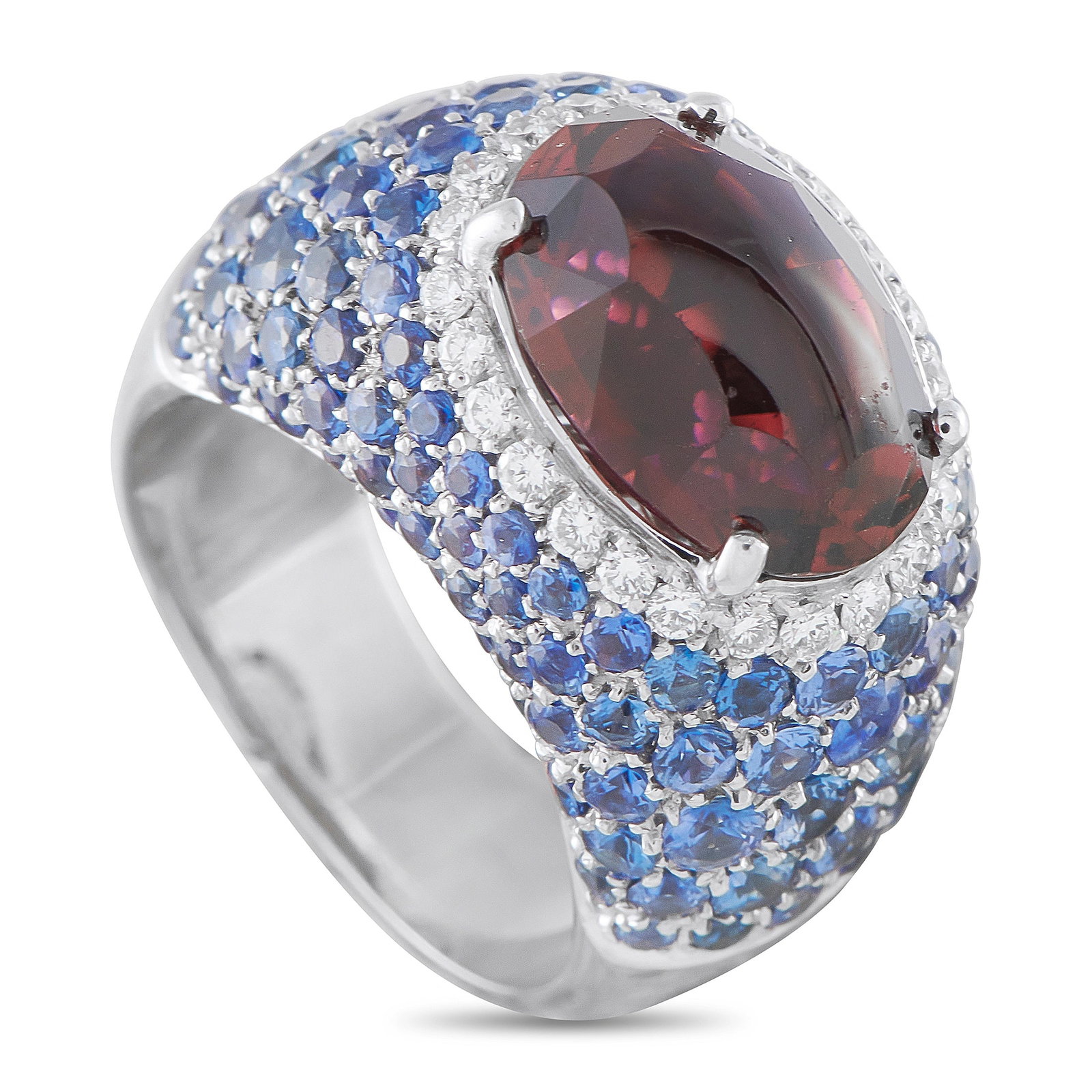 18K White Gold 0.40ct Diamond, Sapphire, and Tourmaline Ring: This exquisite ring will add a touch of color to any ensemble. A 7.0 carat oval-cut Tourmaline gemstone makes a statement at the center, while Diamond accents totaling 0.40 carats and inset Sapphires 