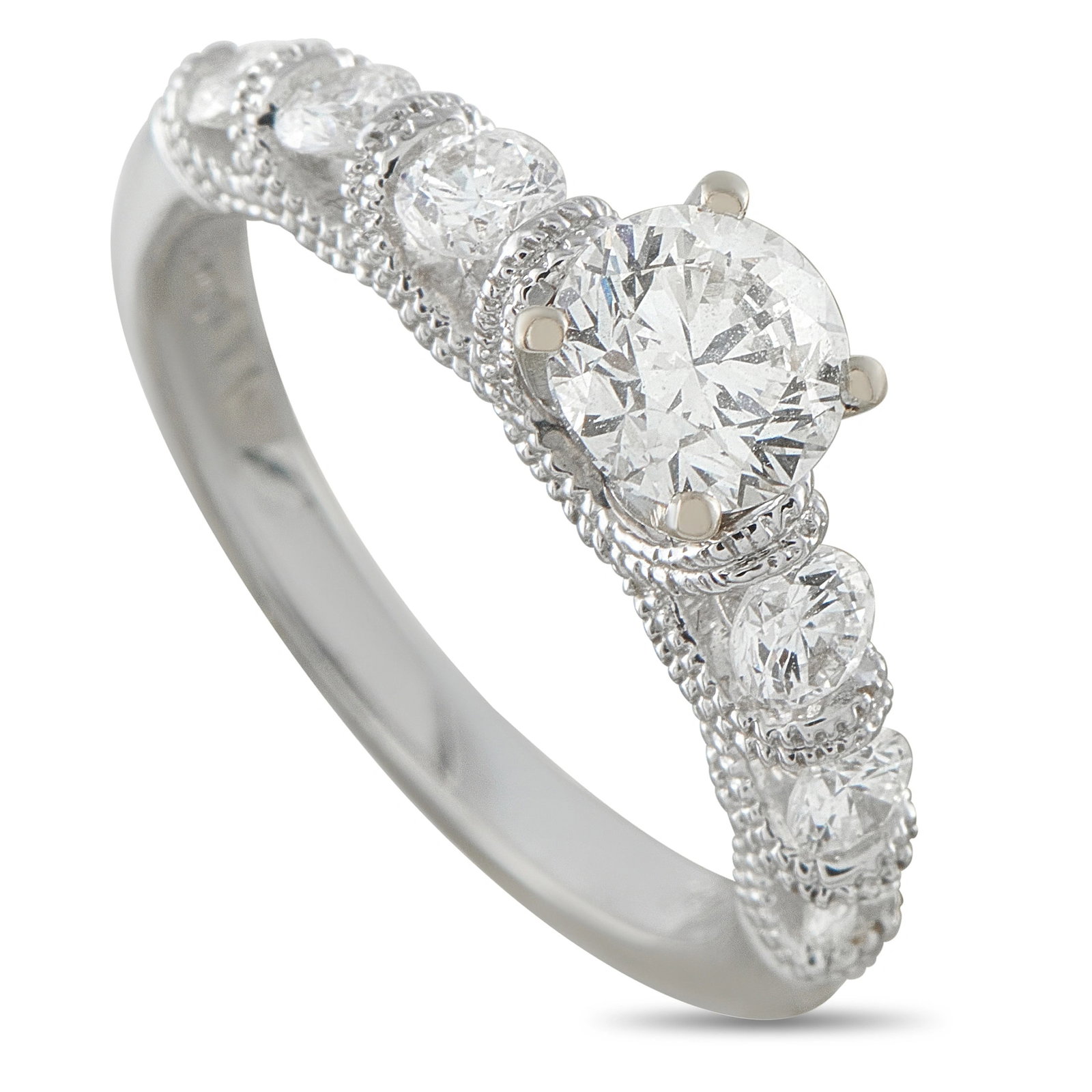 18K White Gold 1.17ct Diamond Ring: This luxury ring is filled with intricate details. The 18K White Gold setting features millegrain details for added texture and dimension. At the center, Diamonds with a total weight of 1.17 carats ma