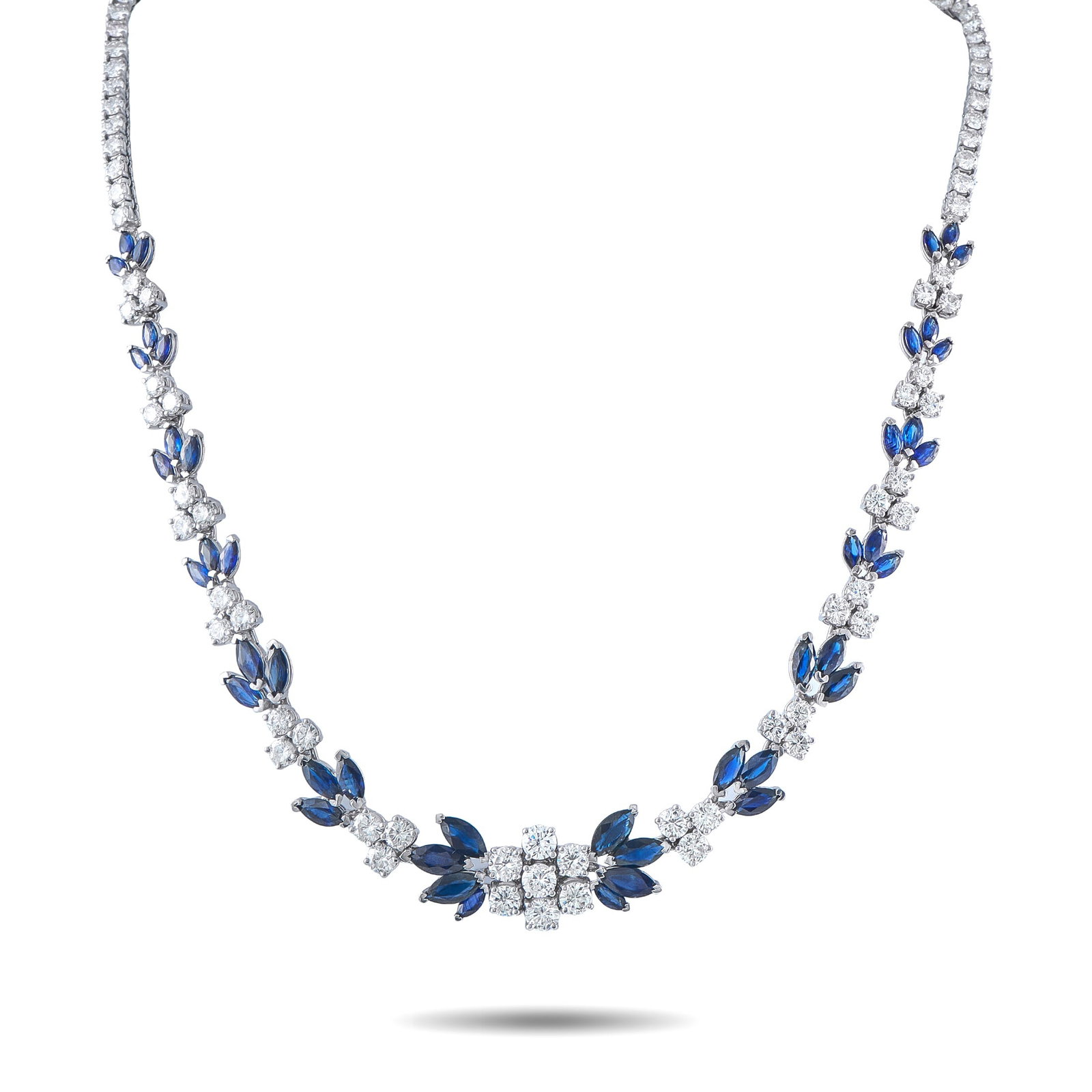 Platinum 17.0ct Diamond and Sapphire Necklace: A breathtaking design makes this luxury necklace impossible to ignore. Sparkling Diamonds with a total weight of 17.0 carats provide endless sparkle. Marquise-cut Sapphires totaling 19.80 carats furth