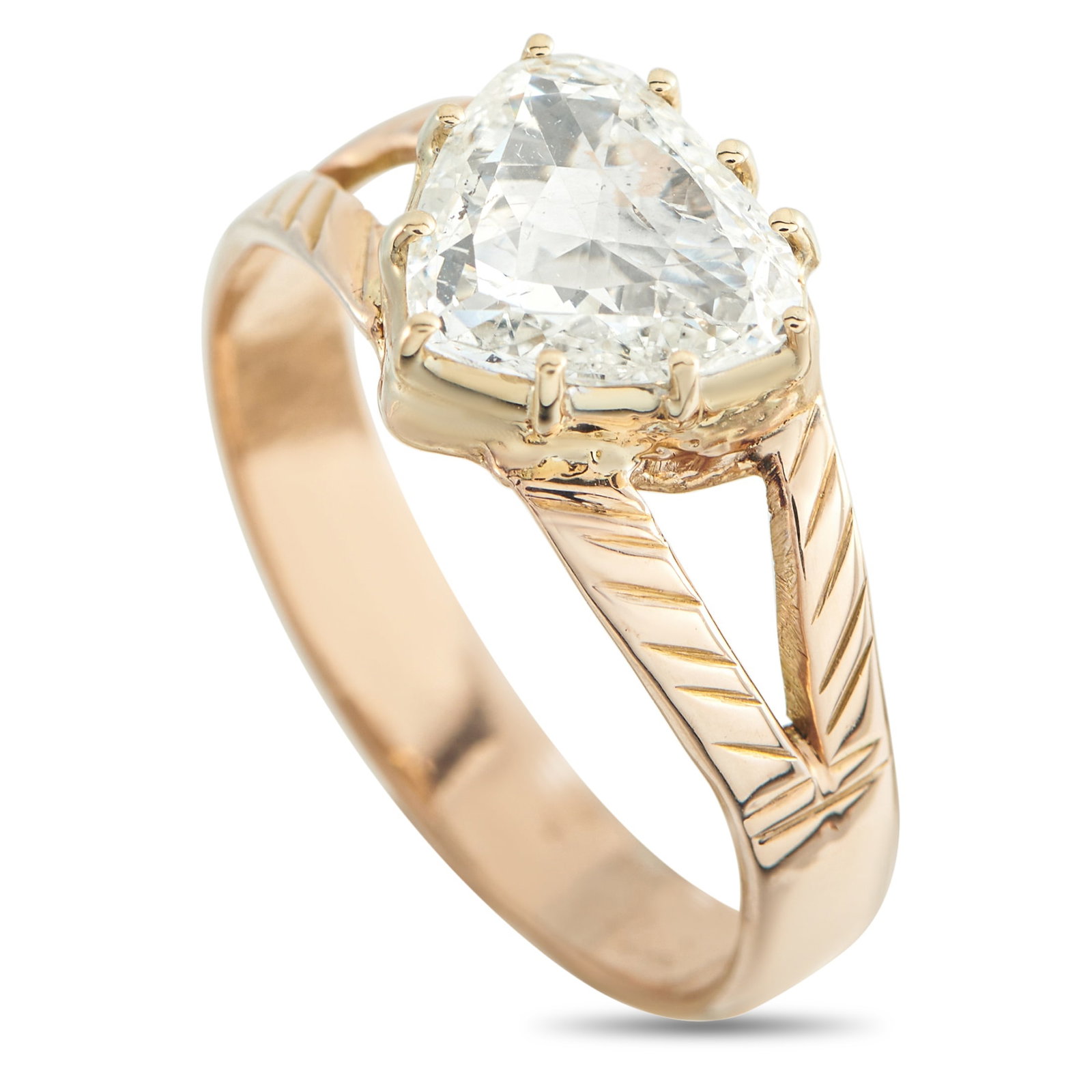 Antique English 9K Rose Gold 1.21ct Diamond Ring: A 1.21 carat heart-shaped Diamond shines brightly at the center of this antique English ring. Simple and elegant, the 9K Rose Gold setting is filled with exquisite details that set this piece apart in