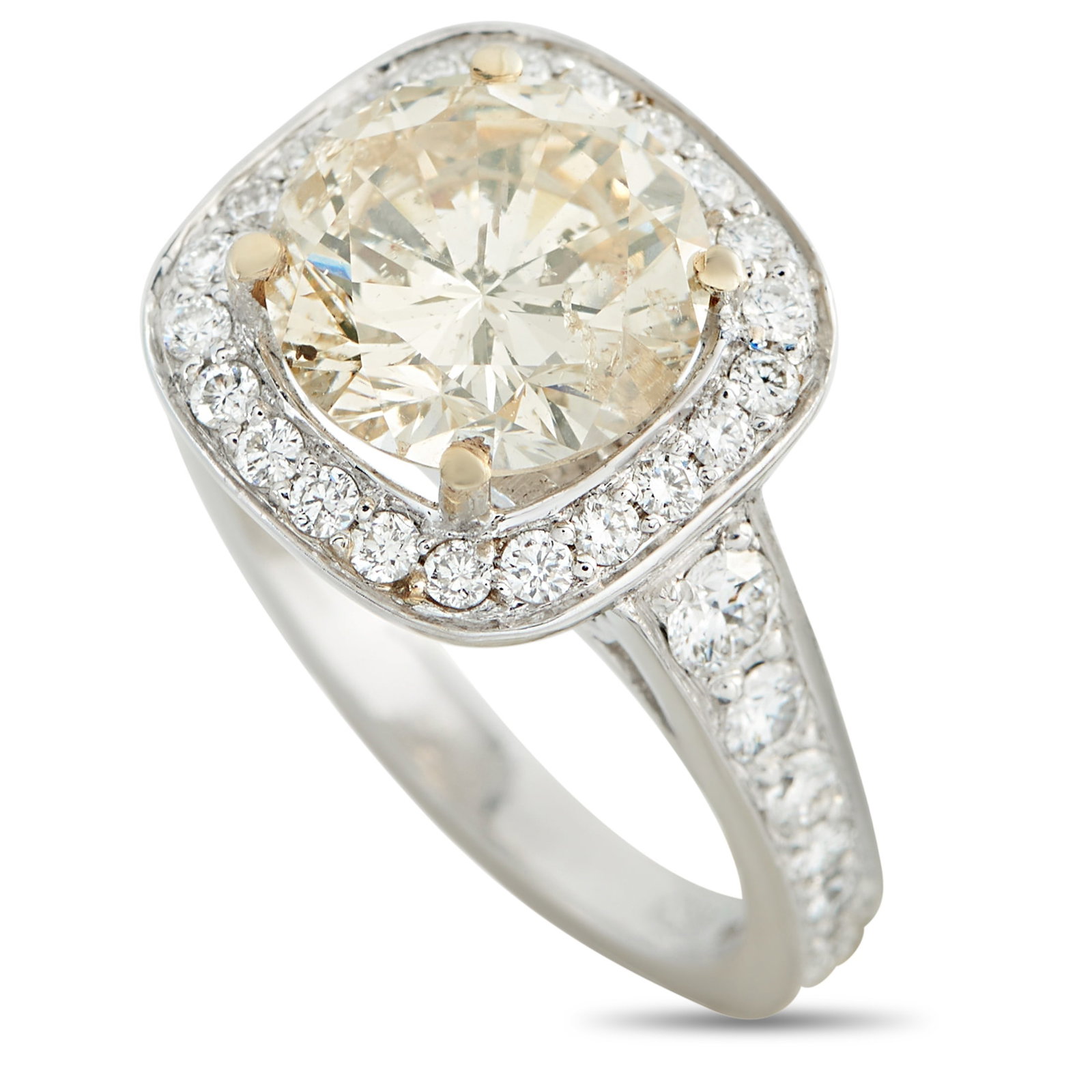 18K White Gold 3.52ct Diamond Ring: This luxury ring is classically elegant. Simple and sophisticated, it features a warm-hued 2.87 carat Diamond center stone. Additional Diamonds totaling 0.65 carats further elevate the minimalist desi