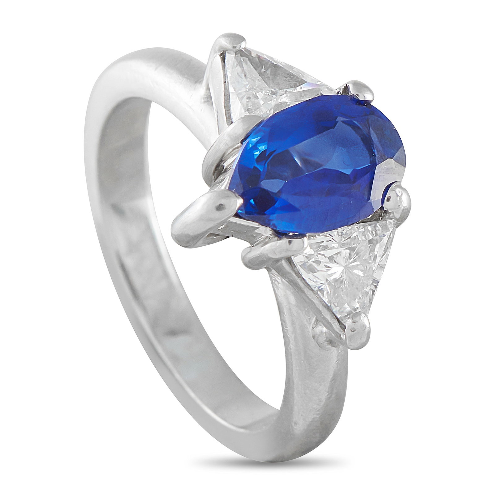 Platinum 0.60ct Diamond and Sapphire Ring: A classic three-stone ring with stronger emotional weight behind it. This platinum piece features a 1.56-carat unheated Burma sapphire whose deep blue surface shifts constantly under light, flanked
