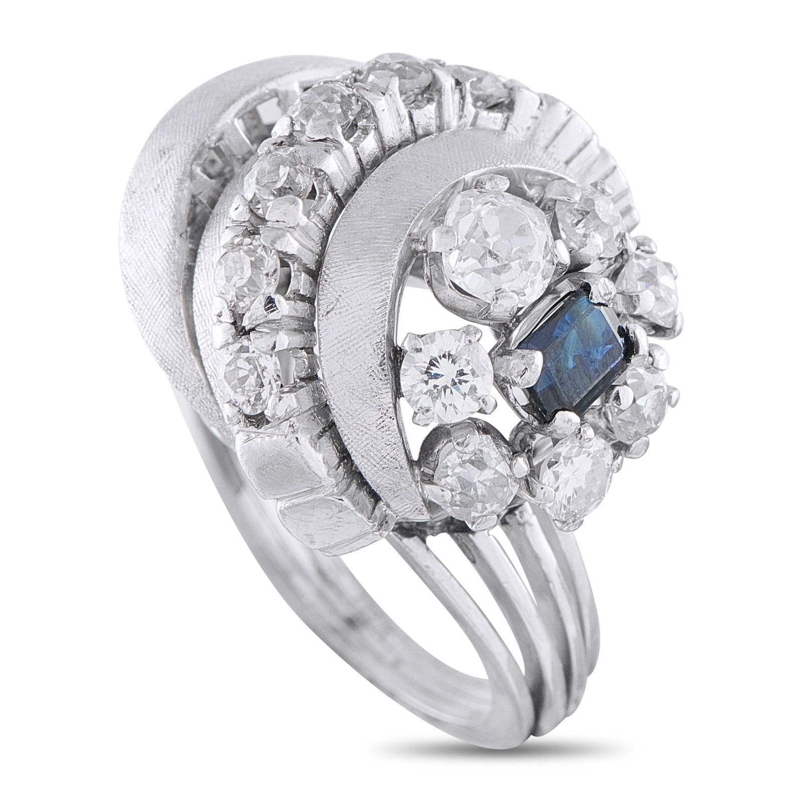 18K White Gold 1.50ct Diamond and Sapphire Ring: This luxury ring is unlike anything you’ve seen before. A dynamic 18K White Gold setting plays with form and dimension. Diamond accents totaling 1.50 carats highlight this piece’s dynamic