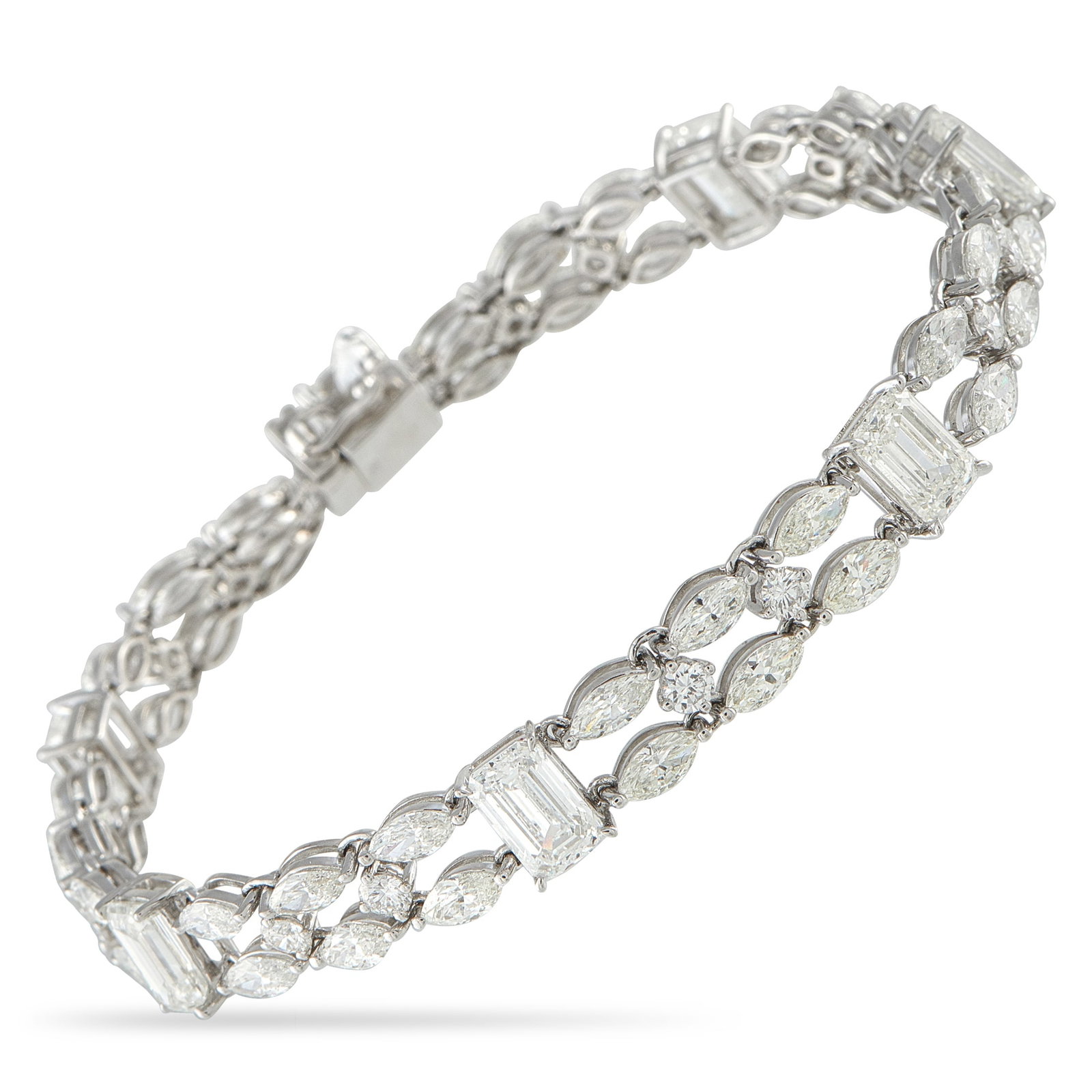 18K White Gold 14.40ct Diamond Bracelet: This luxury bracelet is full of delicate details. Incredibly intricate, this piece shines to life thanks to emerald cut Diamonds totaling 7.10 carats and additional Diamond accents with a total weight