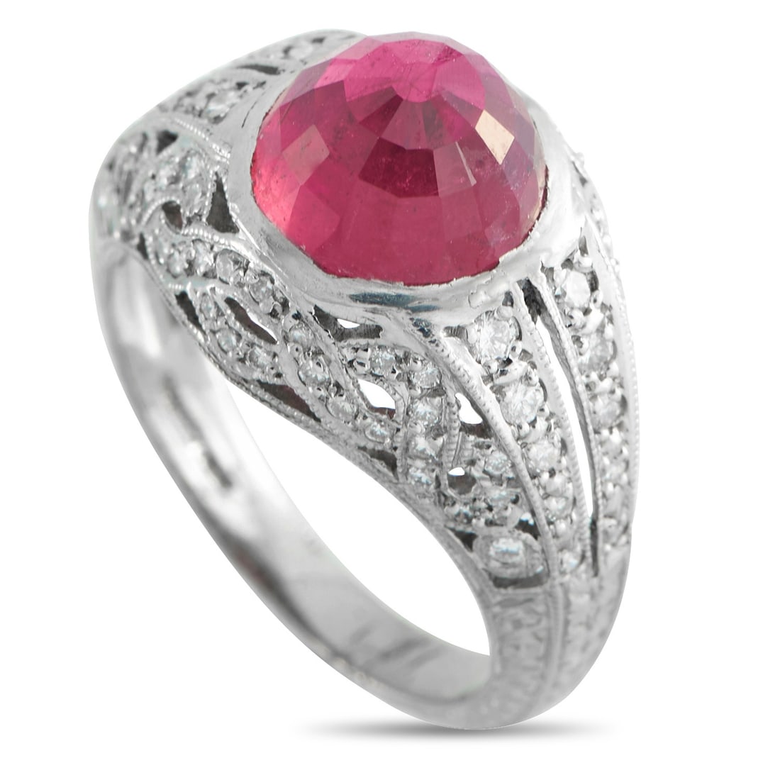 Platinum 0.30ct Diamond and Rubellite Ring: This ring shows ornament held in control. The band is marked “10% Irid Plat,” indicating a platinum-iridium alloy with a slightly firmer feel and bright surface. This band forms a multi-split 