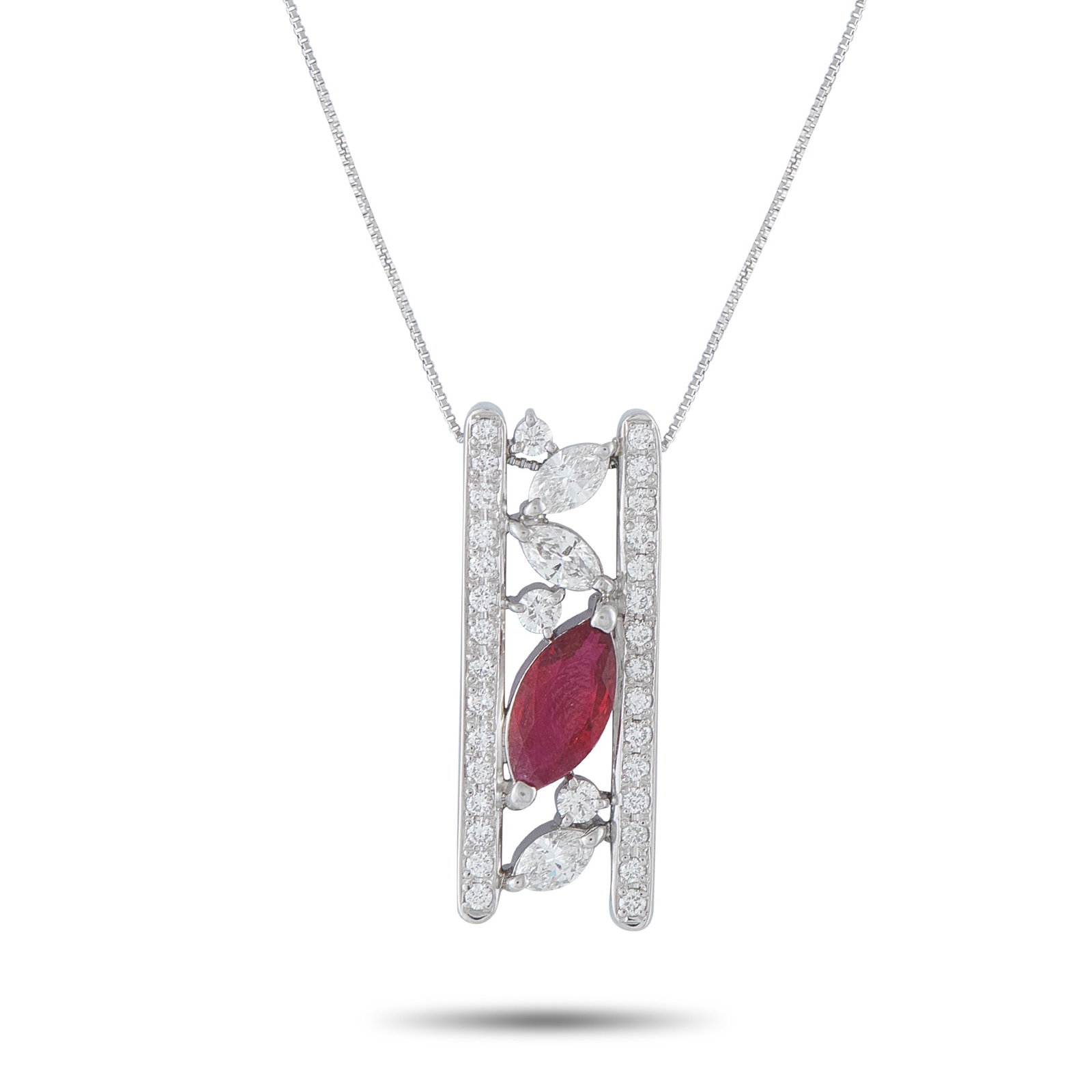 Platinum 1.12ct Diamond and Ruby Necklace: This luxury necklace will elevate any ensemble. Set in Platinum, the dramatic pendant features a unique, openwork design that comes to life thanks to sparkling Diamonds totaling 1.12 carats. A single 