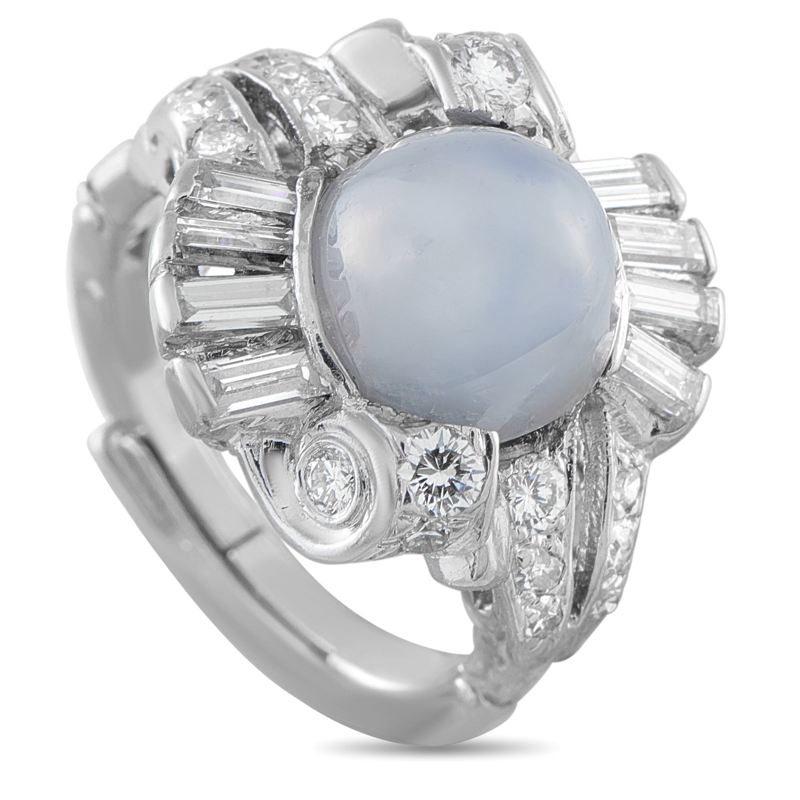 14K White Gold 0.60ct Diamond and Milky Blue Sapphire Cocktail Ring: Mid-century in spirit, this 14k white gold ring embraces movement and volume over strict geometry. A 7.20-carat milky blue sapphire cabochon is at its center. Double scroll motifs curve to cradle the 