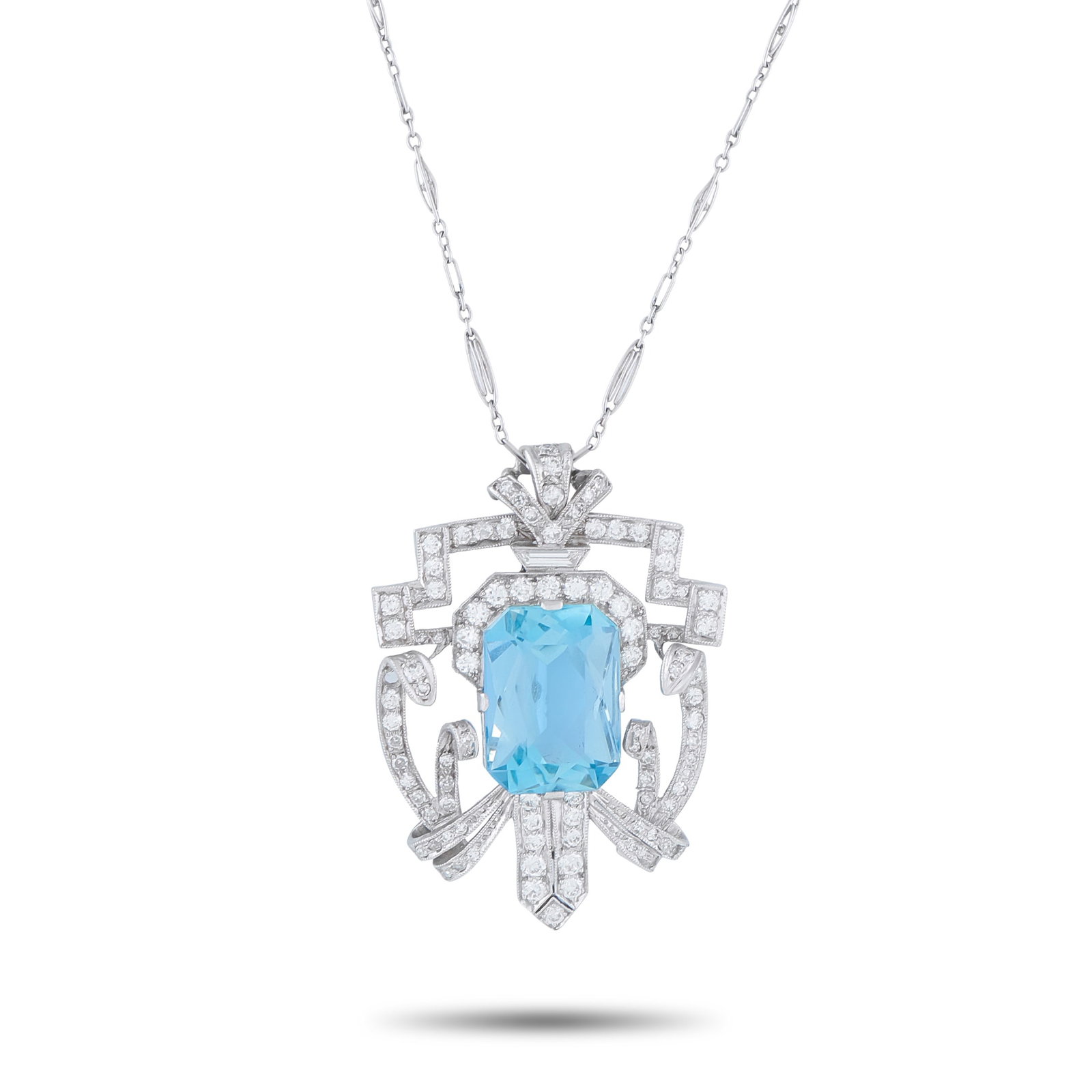Platinum and 14K White Gold 2.0ct Diamond and Aquamarine Pendant: A vibrant 12.0 carat Aquamarine gemstone takes center stage on this exquisite necklace. Incredibly detailed, the pendant is crafted from a combination of Platinum and 14K White Gold. Diamonds with a t