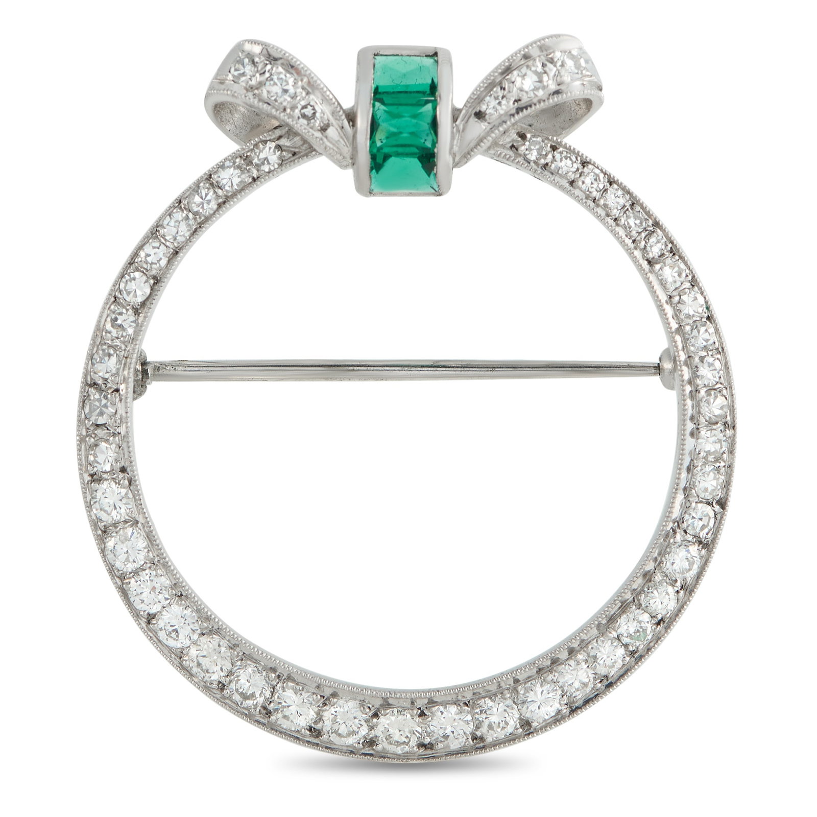Platinum 0.85ct Diamond and Emerald Brooch: This luxury brooch is simple, elegant, and ideal for any occasion. The circular Platinum setting comes to life thanks to sparkling Diamonds with a total weight of 0.85 carats. At the top, Emeralds tot