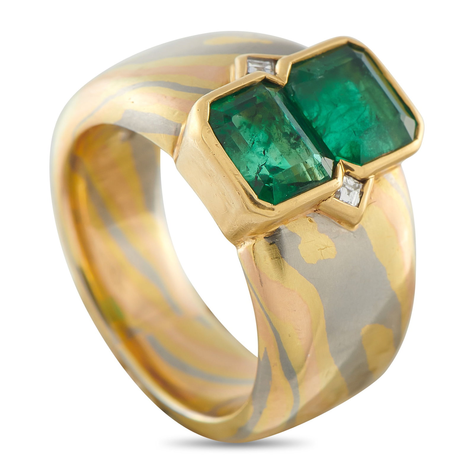 18K Yellow Gold 3.0ct Emerald Ring: This luxury ring features a sleek, contemporary design that will continually make a statement. Crafted from 18K Yellow Gold, twin Emeralds with a total weight of 3.0 carats add style and sophisticatio