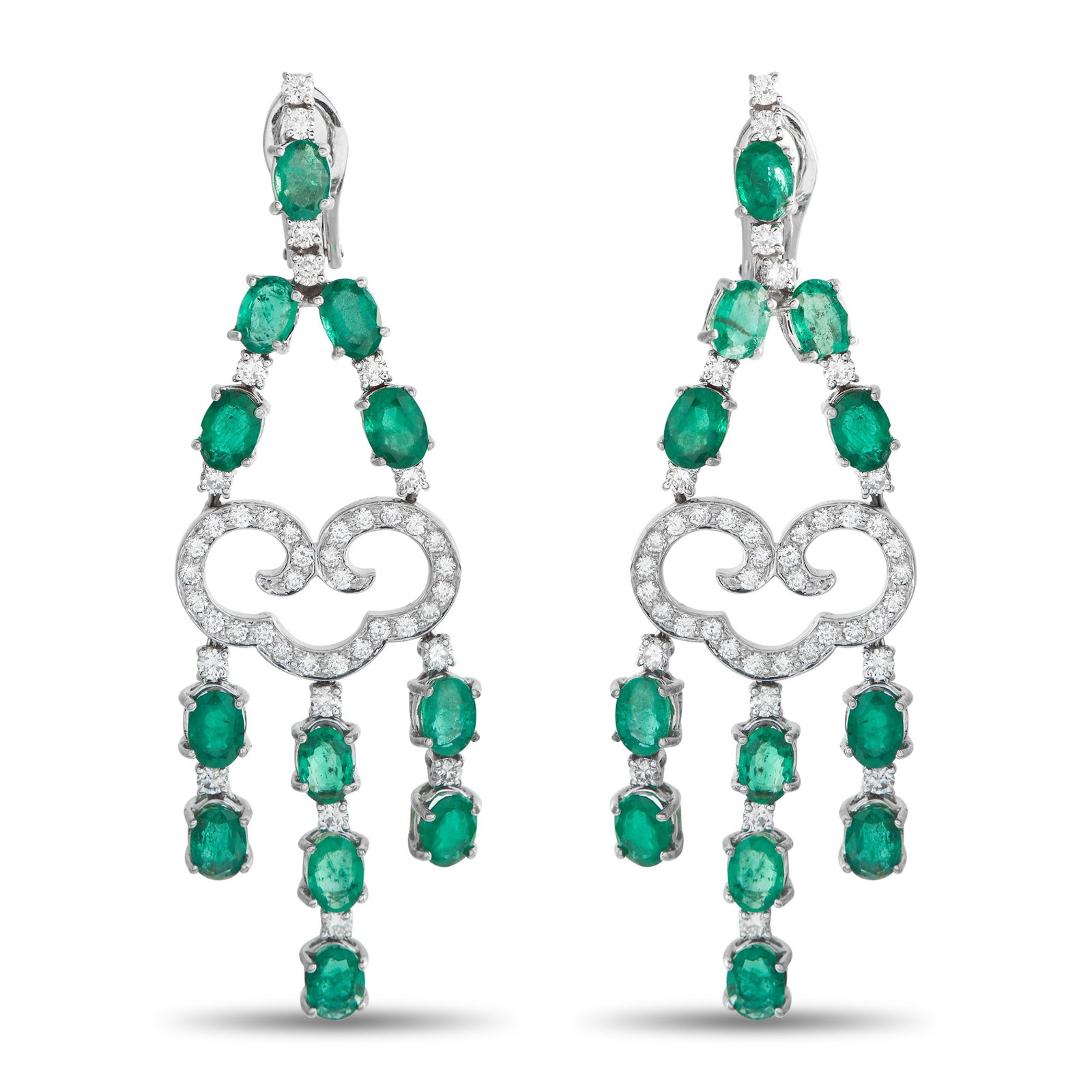 18K White Gold 1.50ct Diamond and Emerald Dangle Earrings: These luxury earrings are elegant enough for even your most special occasions. Crafted from 18K White Gold, the intricate design is elevated by sparkling Diamonds totaling 1.50 carats. Emeralds with a