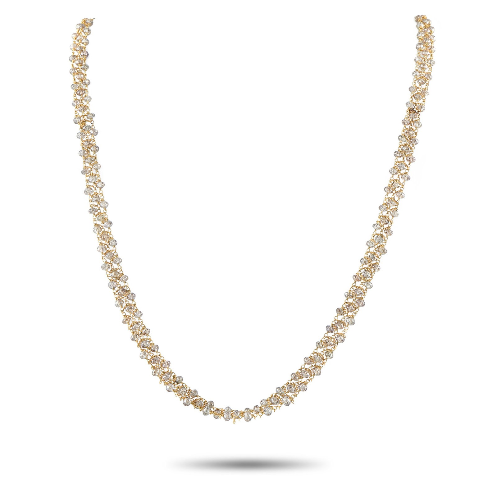 18K Yellow Gold 24.5ct Diamond Briolette Necklace: This piece features an exquisite display of fluid elegance with its meticulously woven design that mimics the effervescence of shimmering bubbles. Rather than traditional prong settings, this necklace