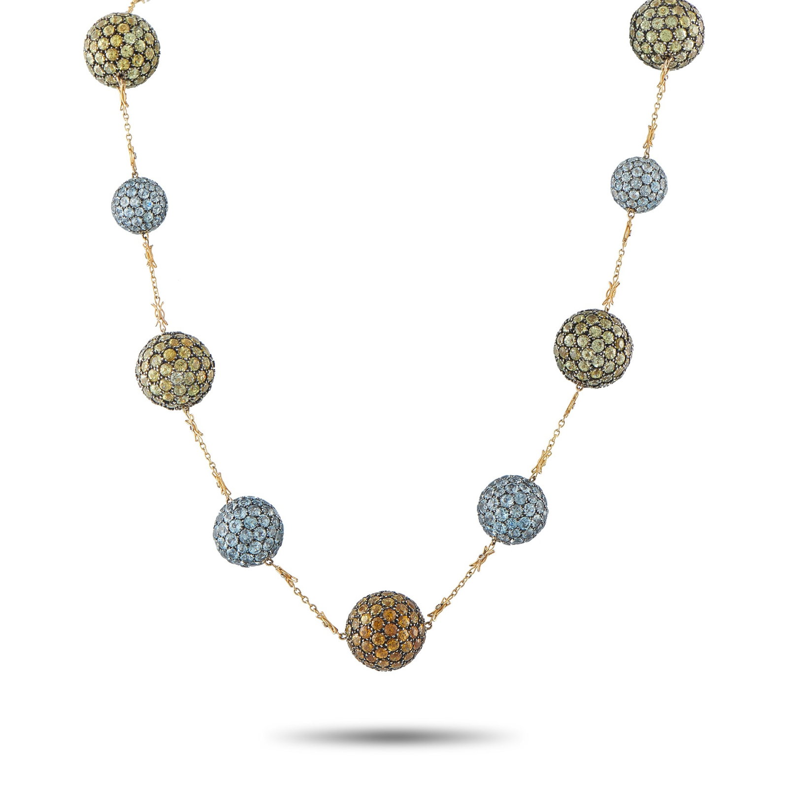 18K Yellow Gold Peridot, Aquamarine, and Citrine Necklace: A stylish, contemporary design sets this luxury necklace apart from all other pieces in your collection. On this elegant accessory, a series of orbs covered in sparkling Peridot, Aquamarine, and Citri