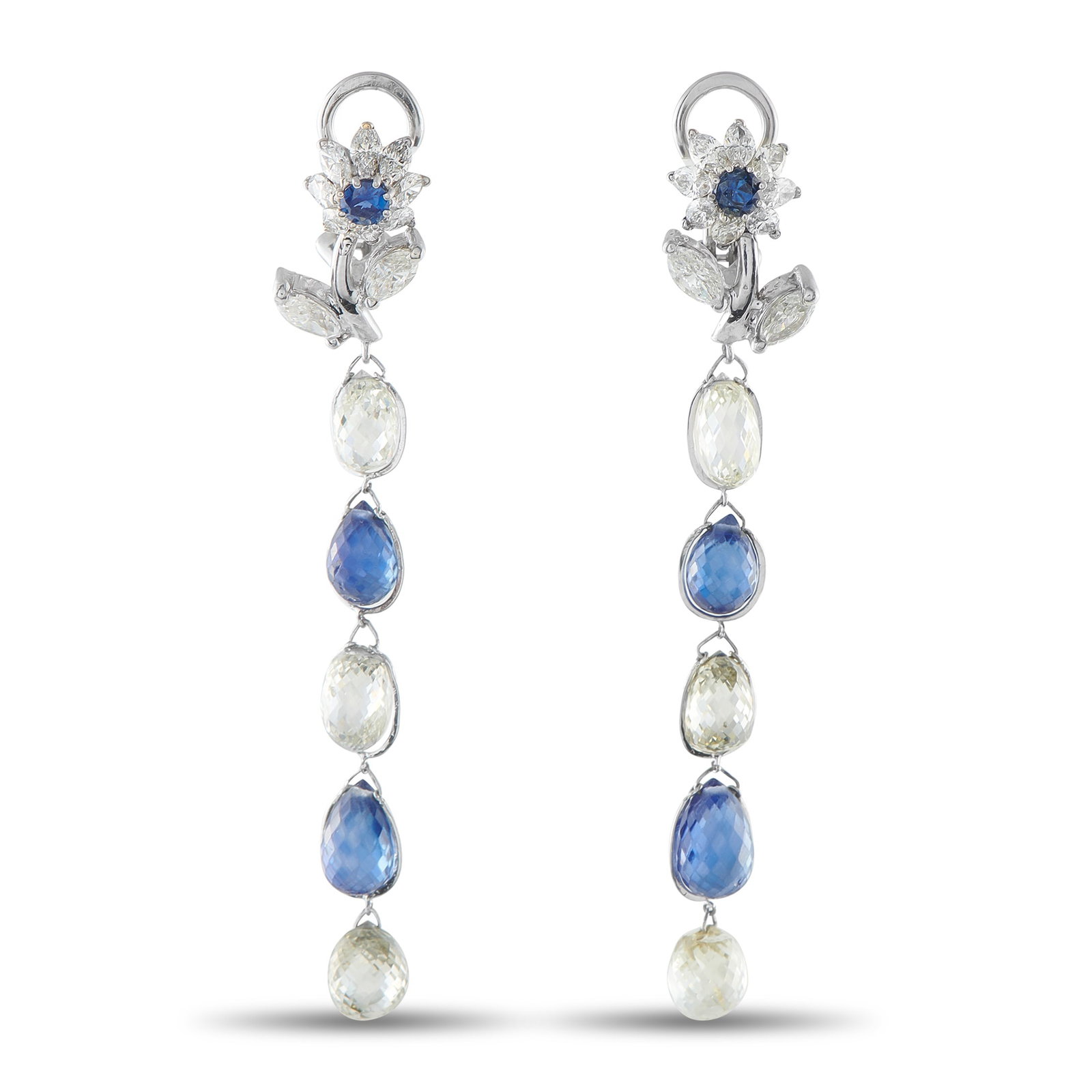Platinum 10.0ct Diamond and Sapphire Earrings: Add sparkle to every movement by adding these luxury earrings to any ensemble. Featuring a floral motif at the base, the sophisticated design comes to life thanks to Diamonds with a total weight of 10