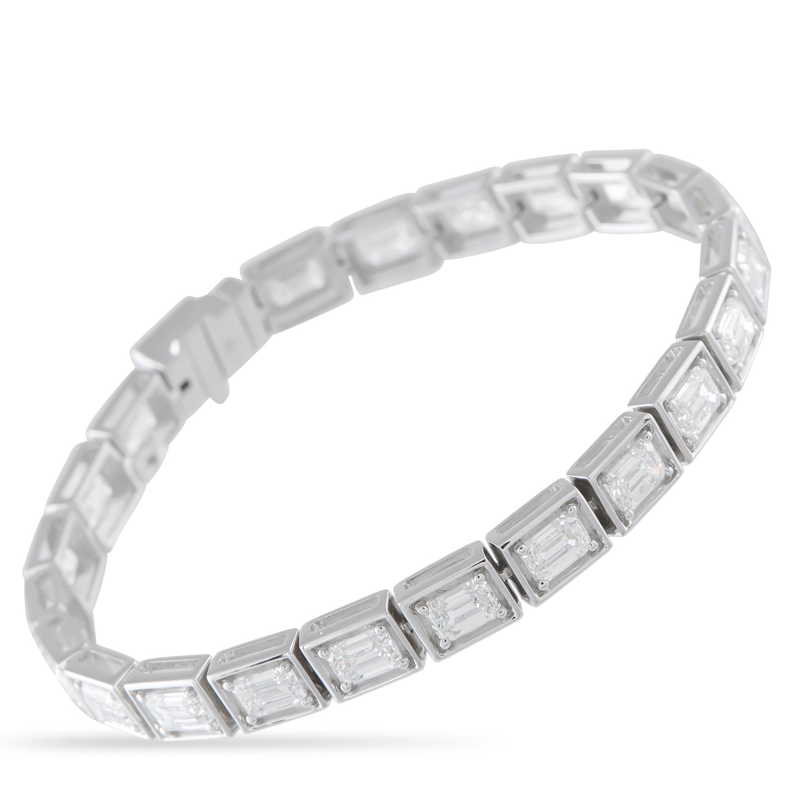 18K White Gold 11.30ct Emerald-Cut Diamond Line Bracelet: Even light, endless line. A steady sparkle defines this line bracelet, shaped by the distinctive brilliance of emerald-cut diamonds. Set in an east-west orientation, each stone is held at the four cor