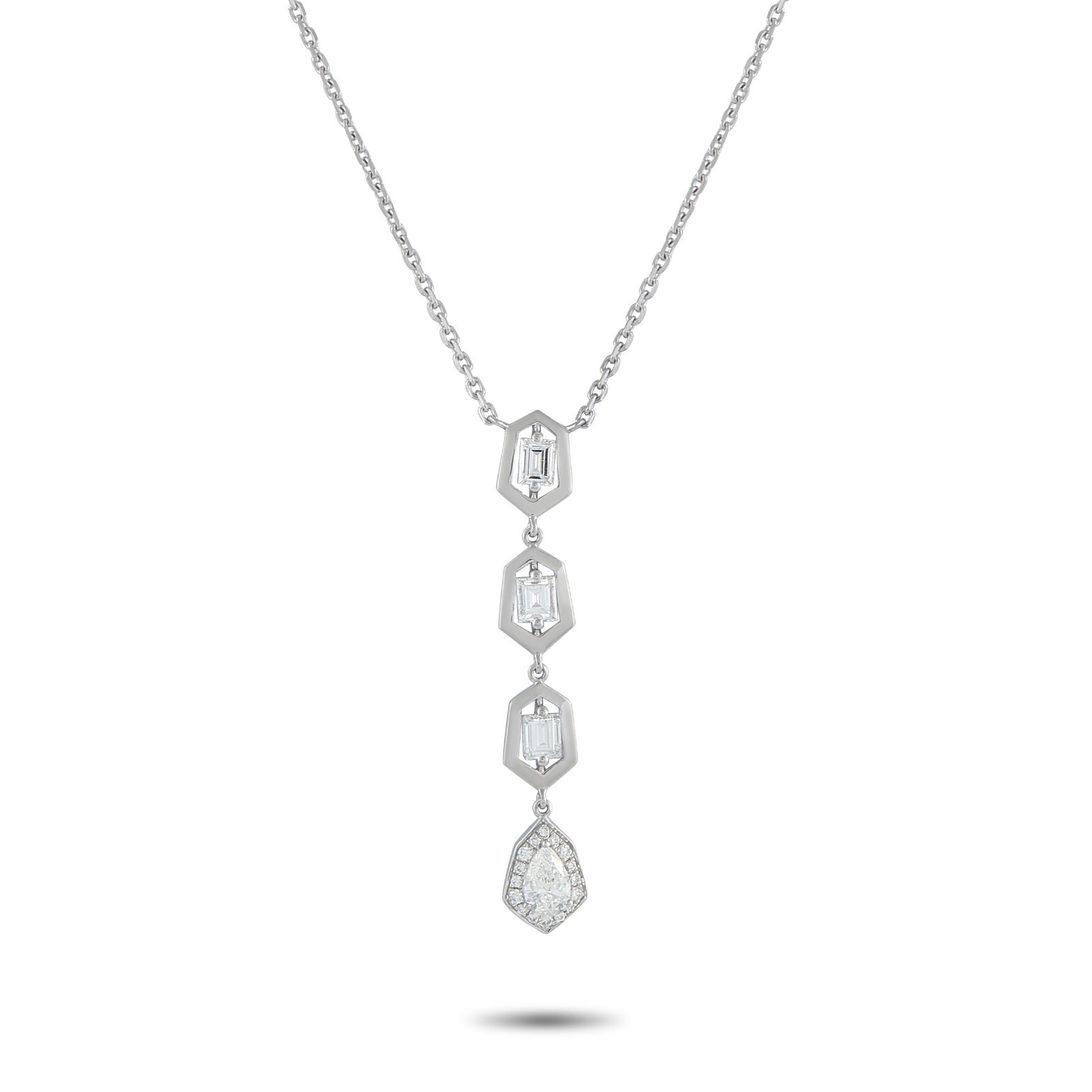 18K White Gold 1.25ct Diamond Geometric Drop Necklace: A modern drop necklace in 18K white gold, where geometry meets sparkle in a vertical flow. The pendant begins with three step-cut diamonds, each encased in a hexagonal frame. These stones guide the ey