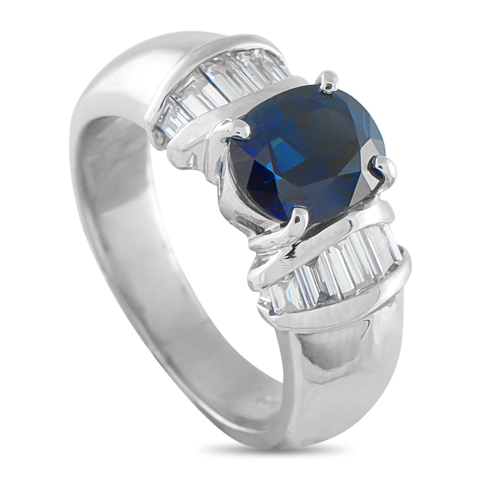 Platinum 0.46ct Diamond and Sapphire Ring: A spectacular 2.18-carat oval sapphire takes center stage, held securely by four classic prongs. Flanking the rich blue center stone are neat collars of baguette diamonds, set within a contemporary ch