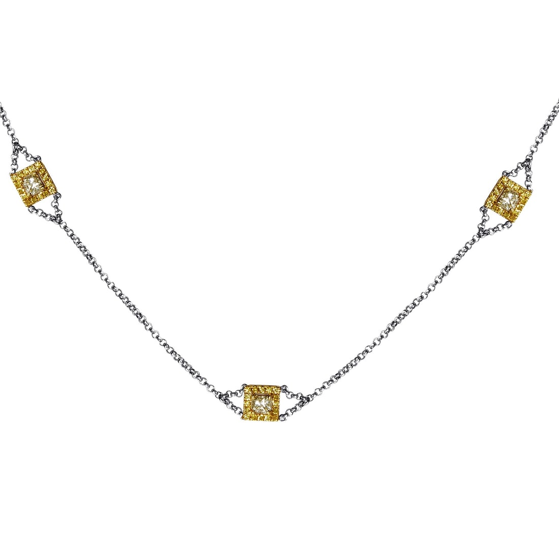 18K Multi-Tone Gold & Diamond Necklace: A touch of luxury to the power of three. Links of 18K White Gold are the connecting thread between three Yelllow Gold pendants. Each petite setting frames a bursting 1.40ct diamond setting. Metal & St