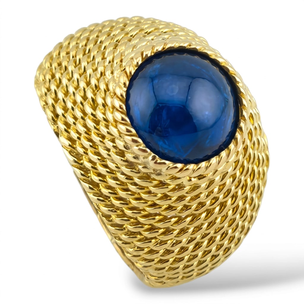 Boucheron Vintage 18K Yellow Gold and 4ct Natural Sapphire Rope Dome Ring: Boucheron Vintage 18K Yellow Gold Sapphire Rope Dome Ring The Boucheron Vintage 18K Yellow Gold Sapphire Rope Dome Ring is a luxurious and elegant piece of jewelry. Crafted with 18K yellow gold, this 