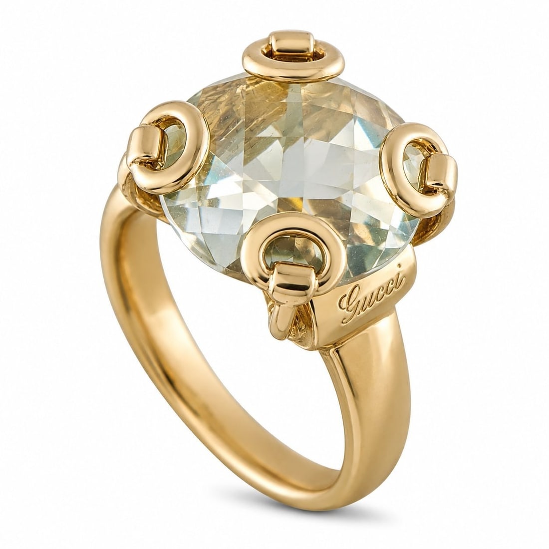 Gucci Horsebit 18K Yellow Gold Topaz Ring: Gucci Horsebit 18K Yellow Gold Topaz Ring This Gucci Horsebit ring is crafted in 18K yellow gold, centering a large checkerboard-cut topaz framed by the brand’s signature horsebit hardware. The ring