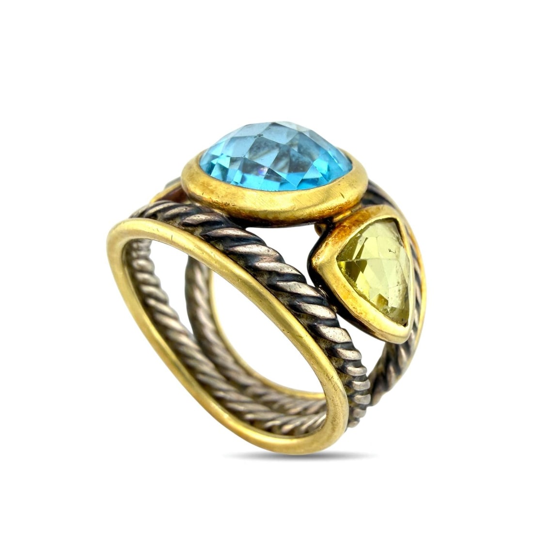 David Yurman Sterling Silver and 18K Yellow Gold Blue Topaz and Rock Crystal Ring: David Yurman Sterling Silver and 18K Yellow Gold Blue Topaz and Rock Crystal Ring This vintage David Yurman ring is crafted in sterling silver with 18K yellow gold detailing. The ring features a round