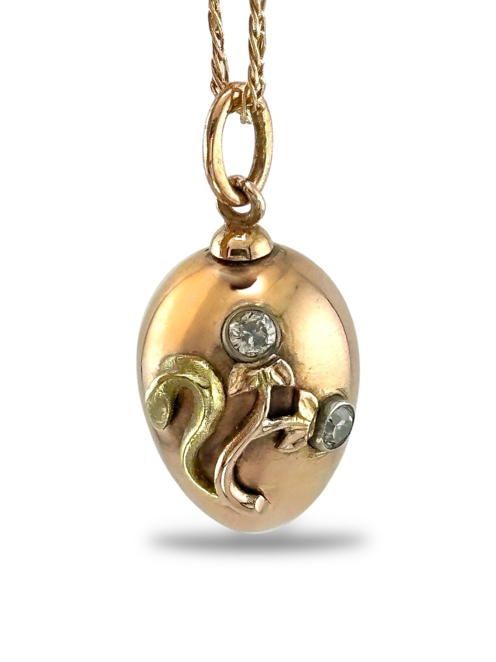 Faberge Jeweled 56K Two-Tone Gold Egg Pendant: Rare Faberge Jeweled 56K Two-Tone Gold Egg Pendant by Anders Nevalainen A finely crafted Imperial Russian two-tone gold egg pendant, richly jeweled. This rare design is signed with the Cyrillic initia