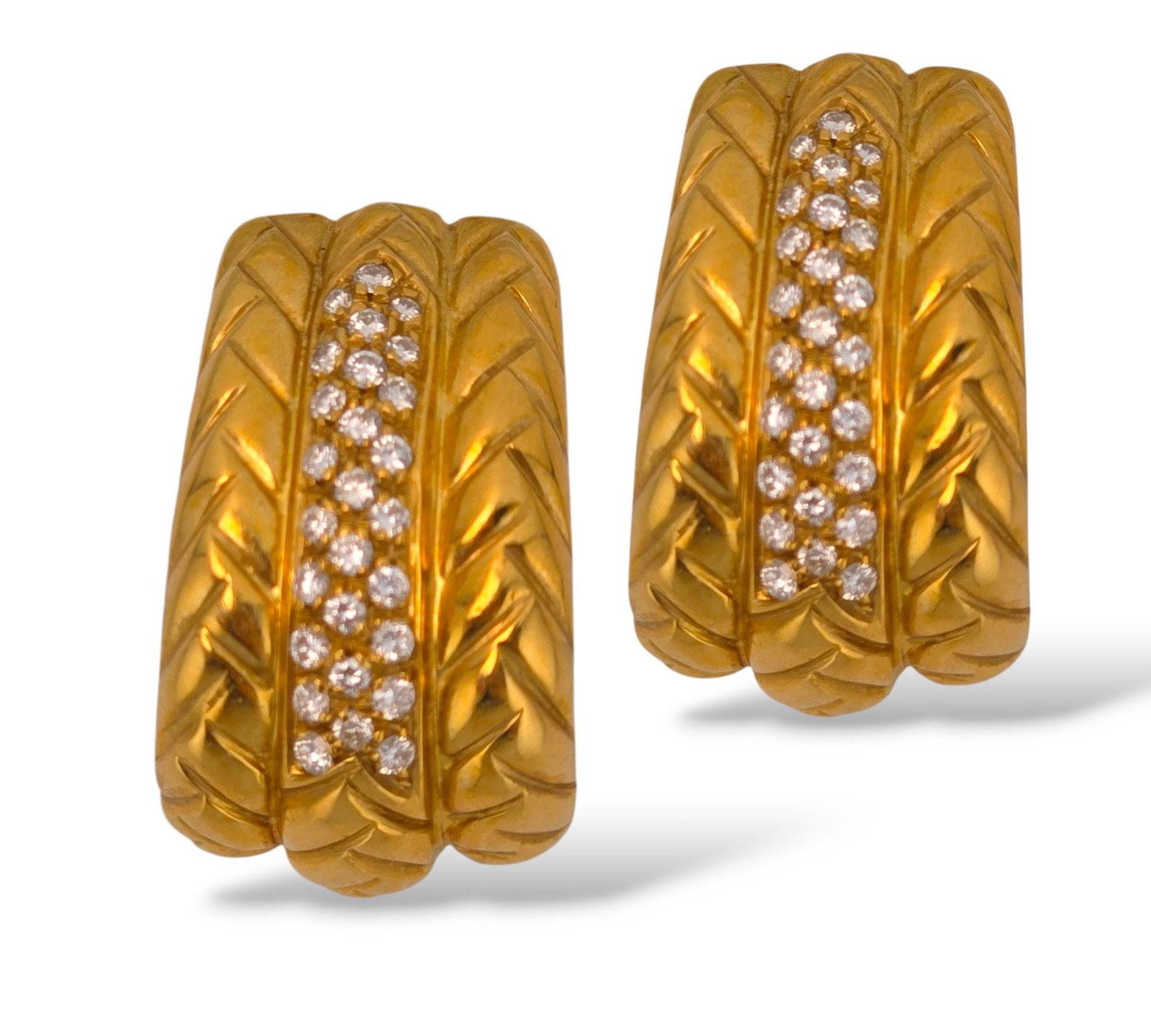 18K Yellow Gold and 1.08ct Diamond Large Huggie Earrings: 18K Yellow Gold Diamond Huggie Earrings 18K Yellow Gold Diamond Huggie Earrings, featuring 54 pave set round brilliant cut diamonds weighing a total of approx. 1.08 carats, worn on earlobes as clip-on