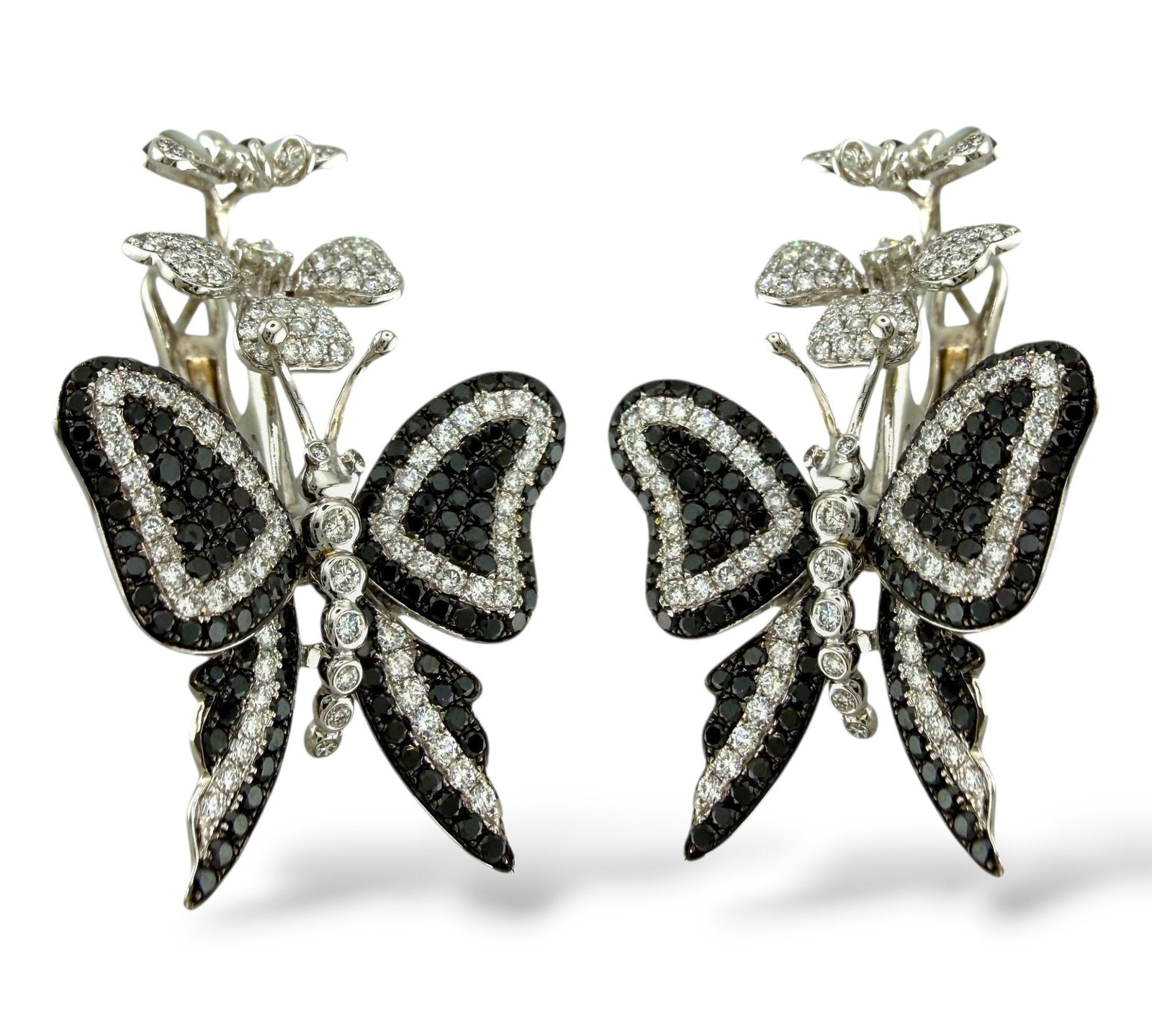 18K White Gold and 1.64ct Diamond Butterfly Flower Earrings: 18K White Gold and 1.64ct Diamond Butterfly Flower Earrings A dazzling celebration of nature's grace, these 18K white gold earrings showcase an enchanting butterfly and flower motif, crowned with a sm