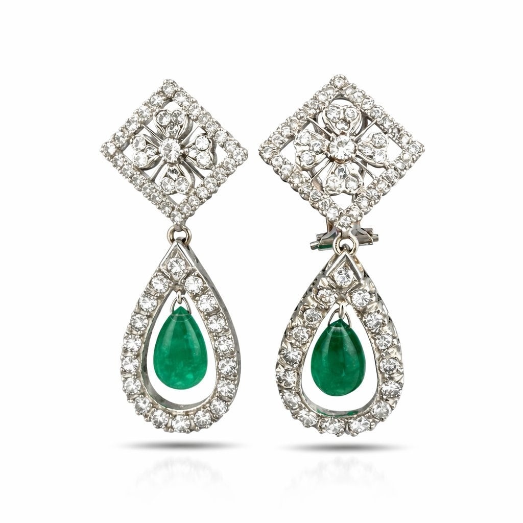 14K White Gold 2.85ct Diamond and Emerald Dangle Earrings: 14K White Gold 2.85ct Diamond and Emerald Dangle Earrings Elegant and sophisticated, these exceptional 14K white gold dangle earrings showcase a refined design with graceful movement and timeless appe