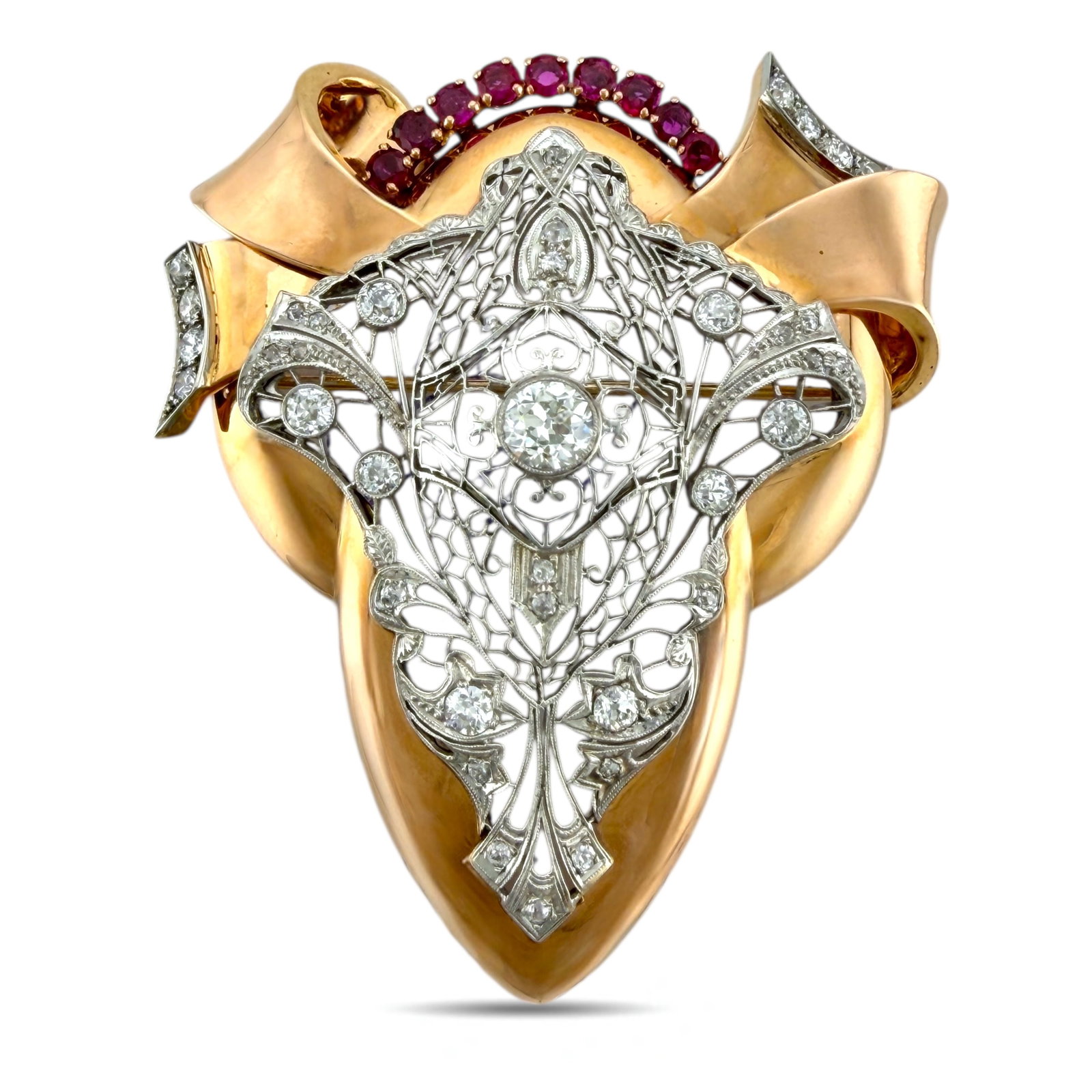 Art Deco 14K Rose Gold 3.1ct Diamond and 1.6ct Ruby Brooch: Art Deco 14K Rose Gold 3.1 Carats Diamond and 1.6 Carat Ruby Brooch and Pendant This striking Art Deco brooch and pendant presents an impressive arrangement of diamonds and rubies surrounding a bold c