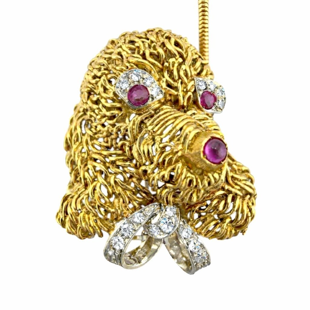 14K Yellow Gold 0.25ct Diamond and Ruby Dog Brooch: 14K Yellow Gold 0.25ct Diamond and Ruby Dog Brooch Pendant A charming and character filled design crafted in rich 18 karat yellow gold, depicting an expressive dog face with fine sculptural detail. Th