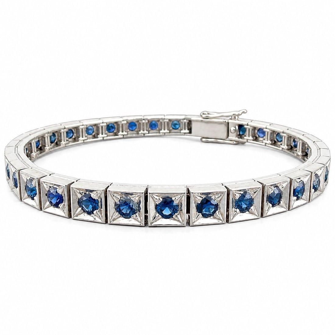 Platinum 4.50ct Sapphire Tennis Bracelet: Platinum 4.50ct Sapphire Tennis Bracelet This elegant tennis bracelet is crafted in platinum and set with a continuous row of sapphires, creating a refined and timeless design. Each sapphire measures