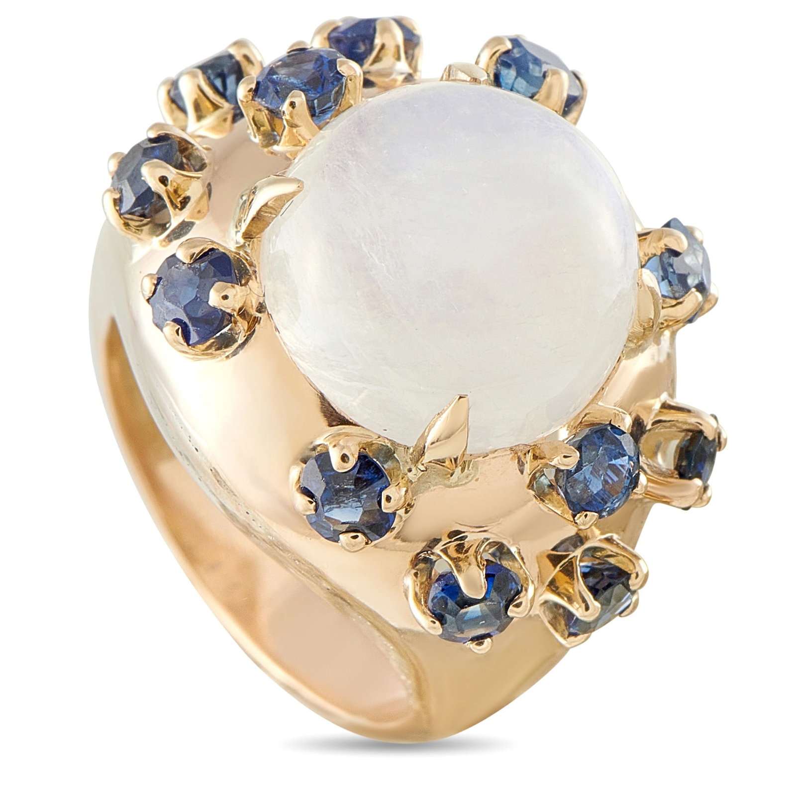 14K Yellow Gold Moonstone and Sapphire Ring: This ring is crafted in 14K yellow gold and centers a cabochon moonstone framed by a halo of round faceted blue sapphires. The ring weighs 18.2 grams. Includes a gift box. Metal & Stones Metal14K Yell